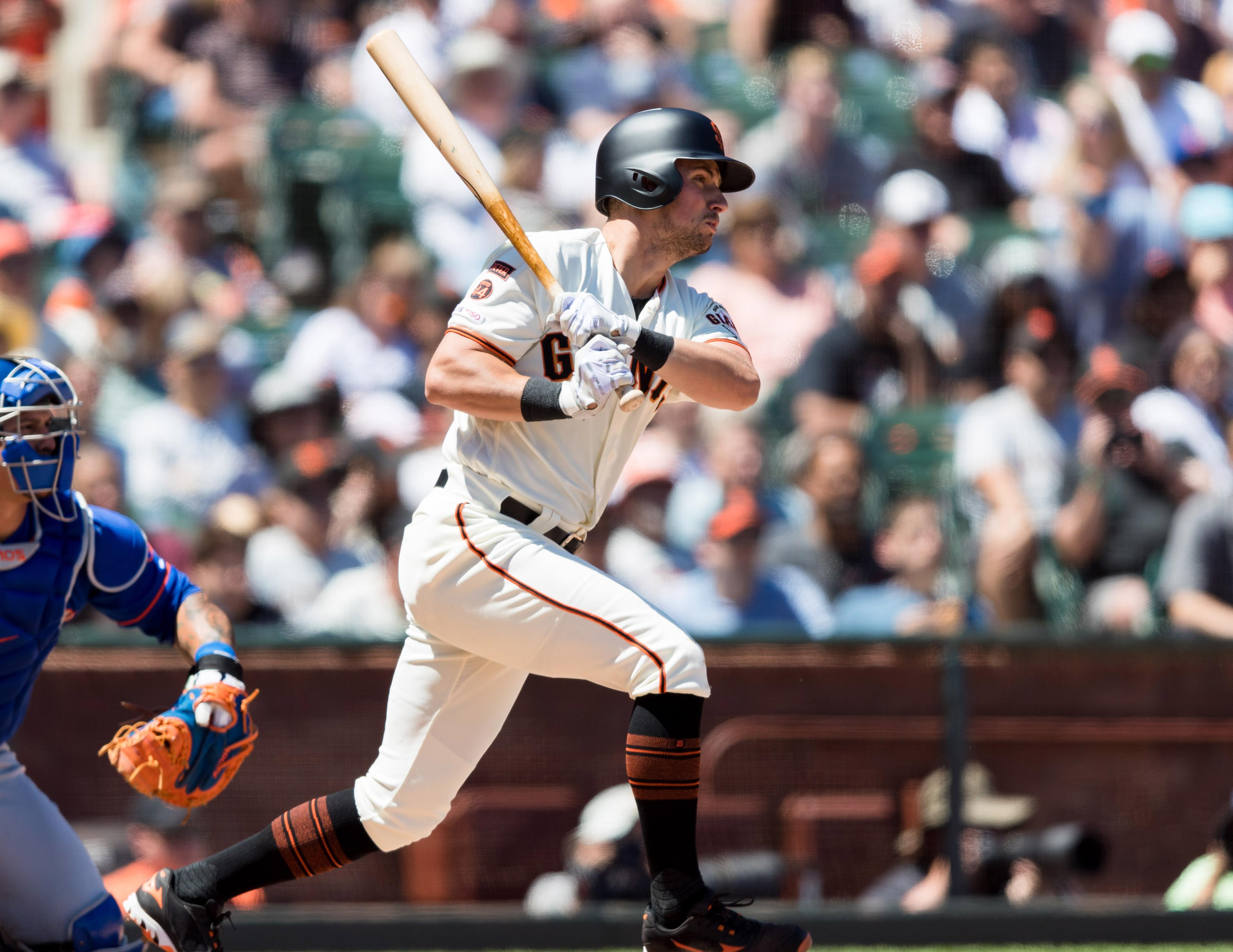 Jul 20, 2019; San Francisco, CA, USA; San Francisco Giants second baseman Joe Panik (12) hits an RBI single against the New York Mets in the fifth inning at Oracle Park. Mandatory Credit: John Hefti-USA TODAY Sports