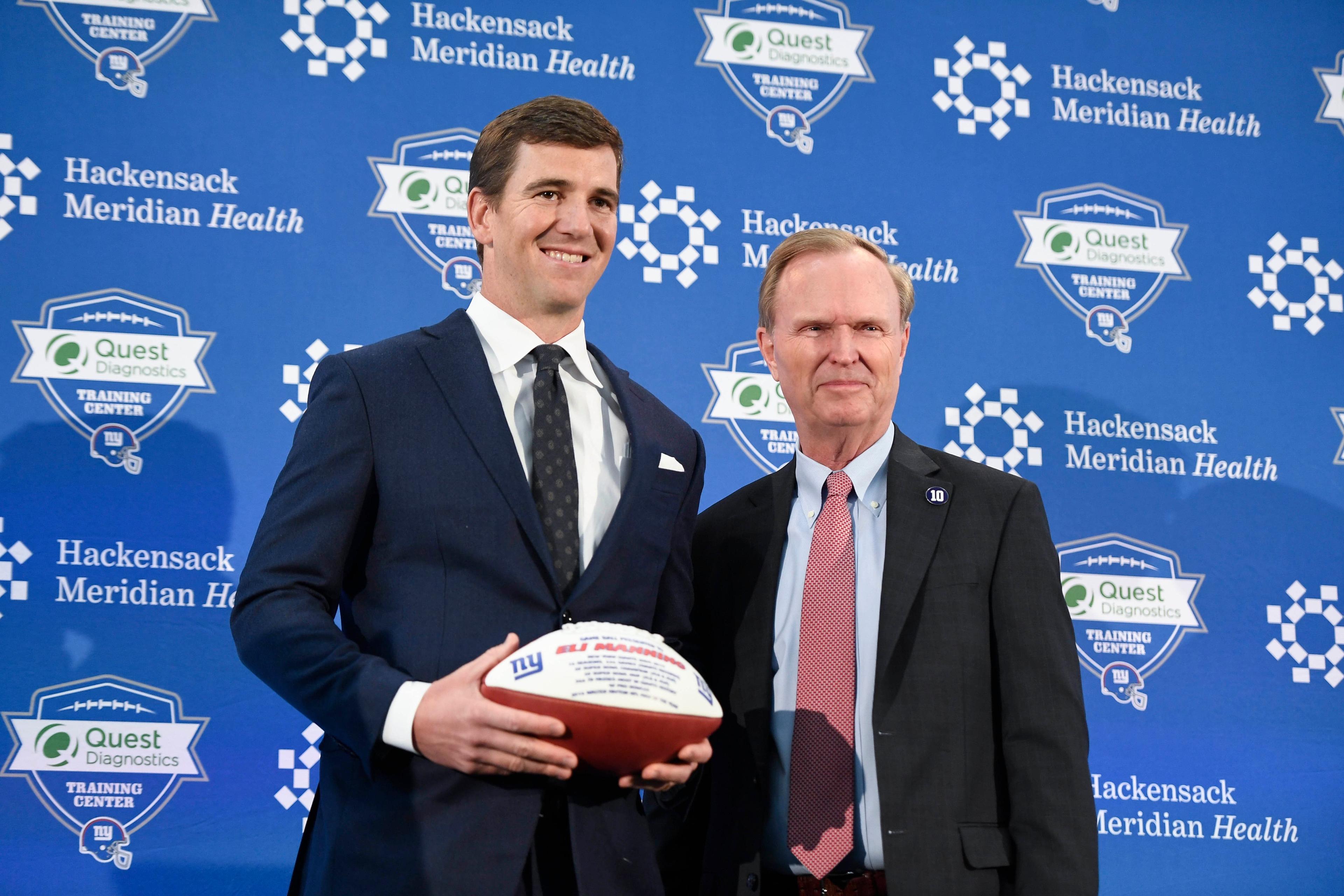 Jan 24, 2020; East Rutherford, New Jersey, USA; New York Giants quarterback Eli Manning, left, and Giants CEO John Mara pose for photos at Quest Diagnostics Training Center. Mandatory Credit: Danielle Parhizkaran-USA TODAY Sports / Danielle Parhizkaran