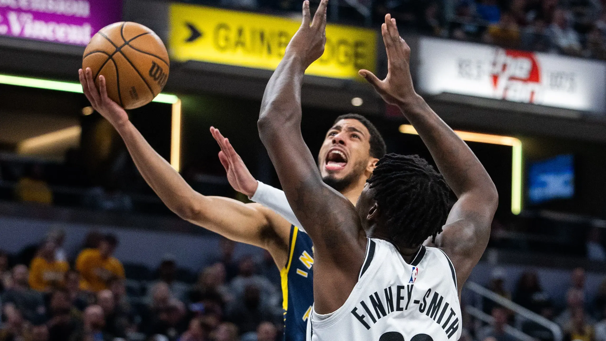 Indiana Pacers guard Tyrese Haliburton (0) shoots the ball while Brooklyn Nets forward Dorian Finney-Smith (28) defends in the first half at Gainbridge Fieldhouse / Trevor Ruszkowski - USA TODAY Sports