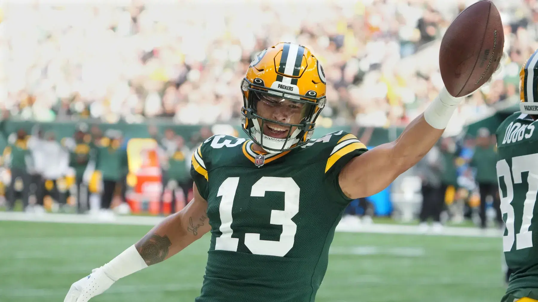 Oct 9, 2022; London, United Kingdom; Green Bay Packers wide receiver Allen Lazard (13) celebrates after scoring a touchdown in the first quarter against the New York Giants during an NFL International Series game at Tottenham Hotspur Stadium. / Kirby Lee-USA TODAY Sports