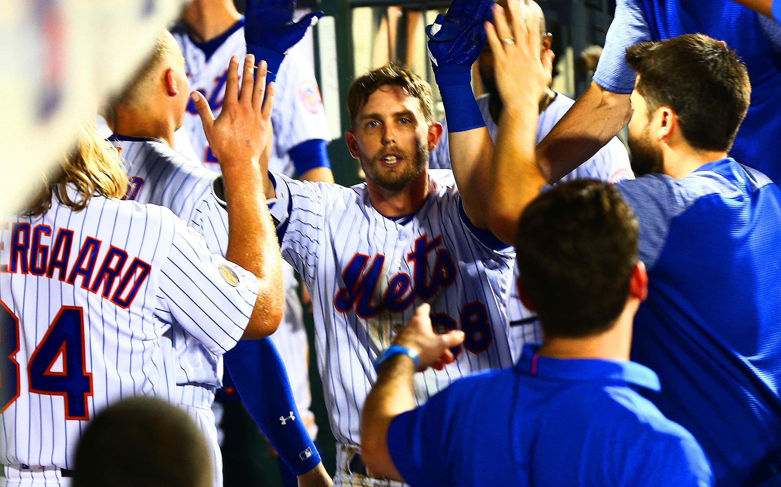 Aug 6, 2018; New York City, NY, USA; New York Mets second baseman Jeff McNeil (68) is congratulated in the dugout after hitting a solo home run against the Cincinnati Reds during the sixth inning at Citi Field. Mandatory Credit: Andy Marlin-USA TODAY Sports