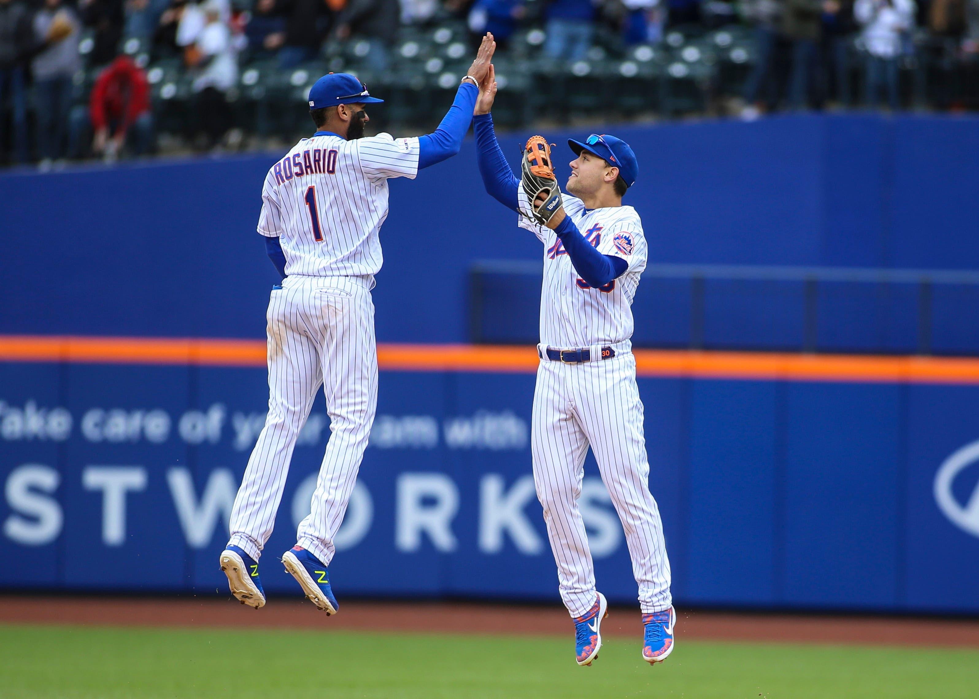 Apr 28, 2019; New York City, NY, USA; New York Mets shortstop Amed Rosario (1) celebrates with outfielder Michael Conforto (30) after defeating the Milwaukee Brewers at Citi Field. Mandatory Credit: Wendell Cruz-USA TODAY Sports / Wendell Cruz