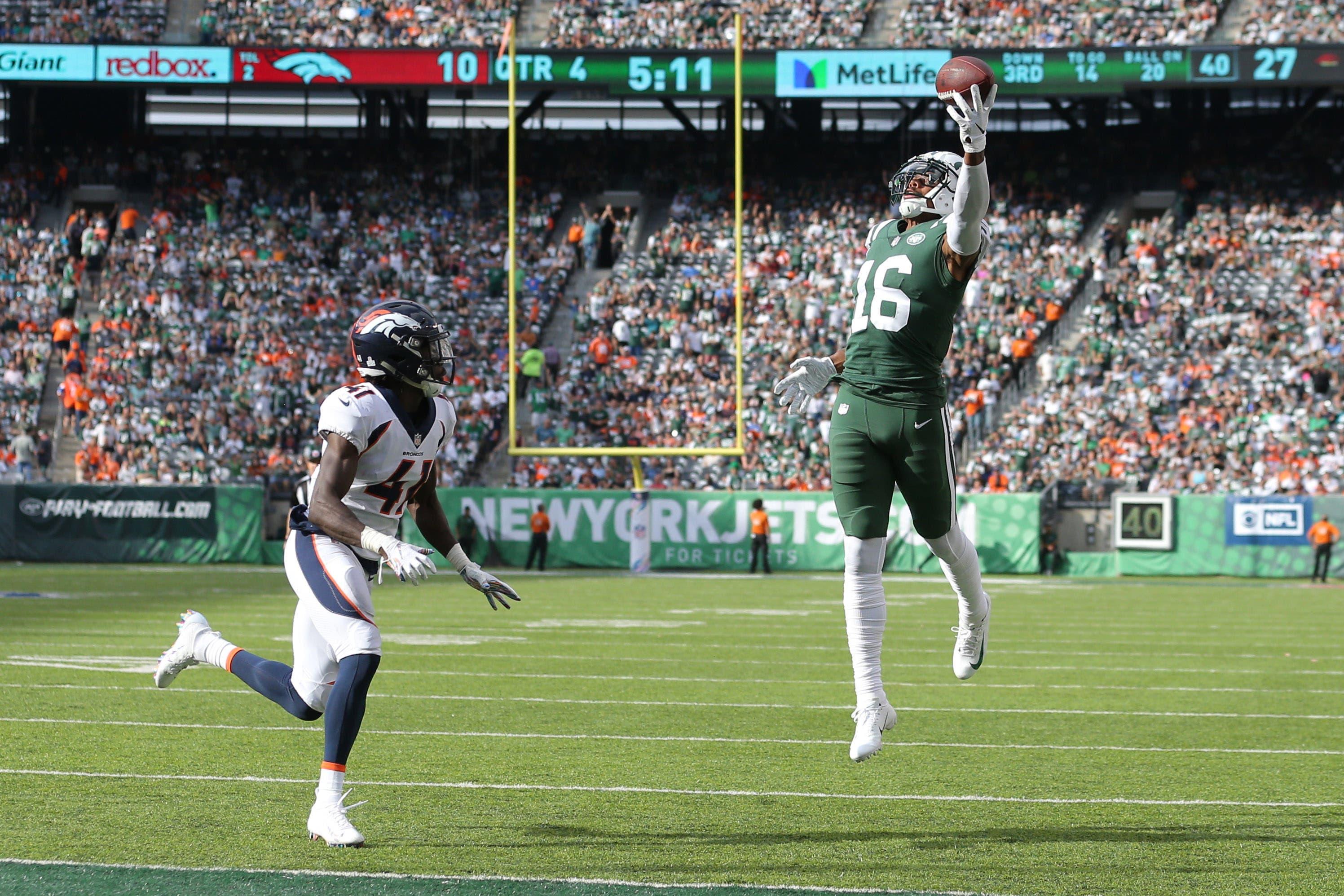 Oct 7, 2018; East Rutherford, NJ, USA; New York Jets wide receiver Terrelle Pryor (16) catches a touchdown pass against Denver Broncos cornerback Isaac Yiadom (41) during the fourth quarter at MetLife Stadium. Mandatory Credit: Brad Penner-USA TODAY Sports / Brad Penner