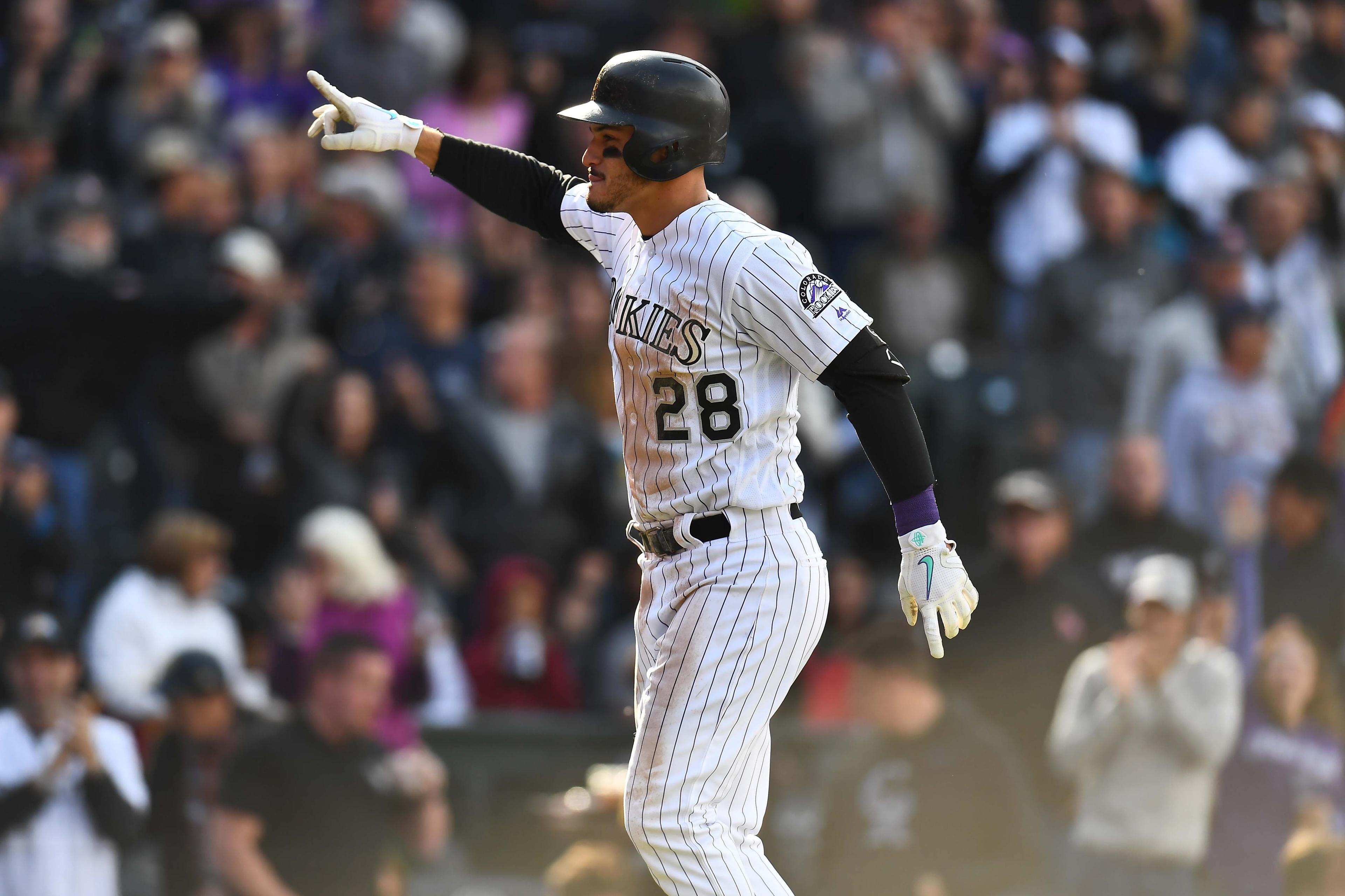 Sep 30, 2018; Denver, CO, USA; Colorado Rockies third baseman Nolan Arenado (28) celebrates his second home run of the game a solo home run in the seventh inning against the Washington Nationals at Coors Field. Mandatory Credit: Ron Chenoy-USA TODAY Sports / Ron Chenoy