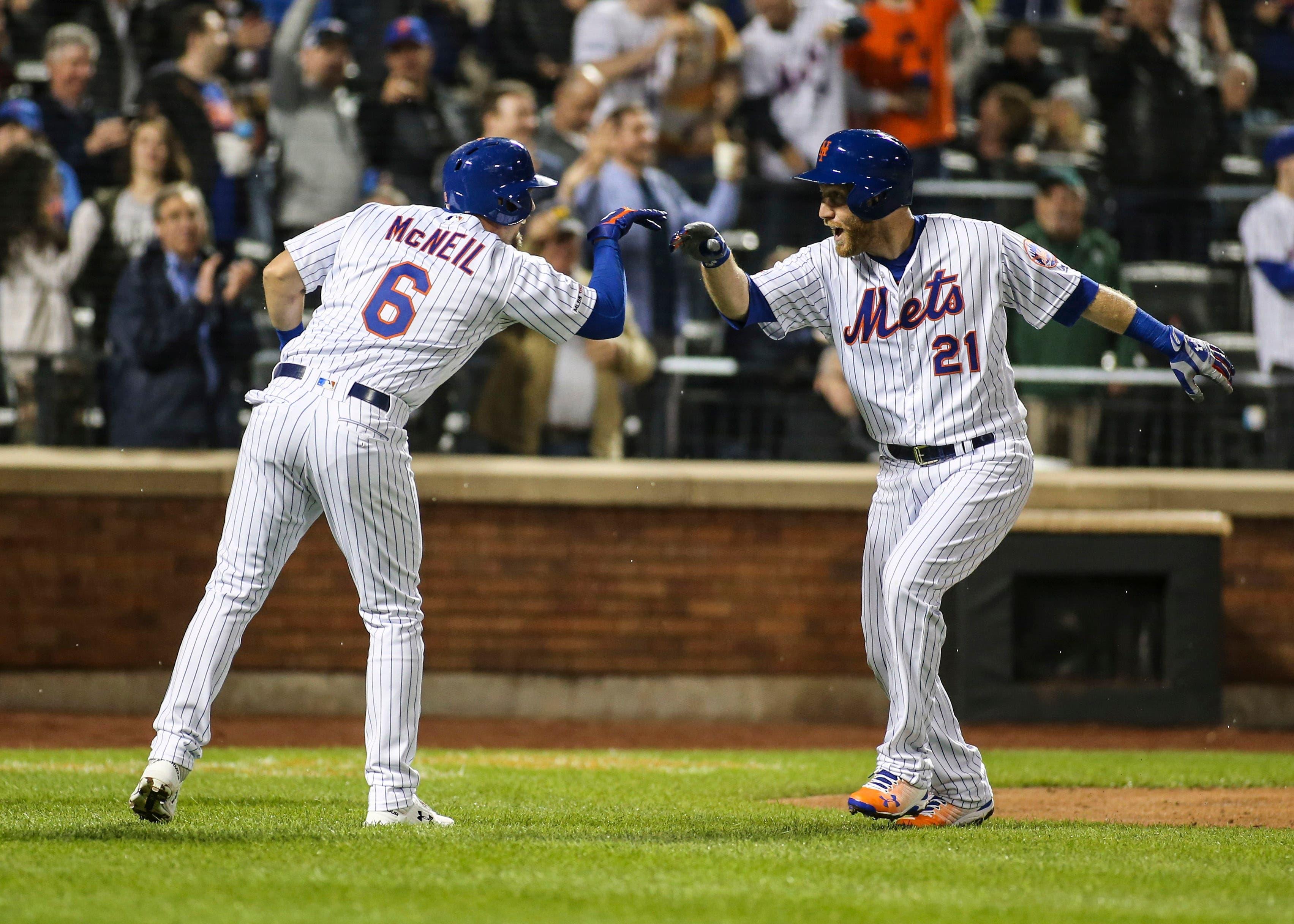 Apr 23, 2019; New York City, NY, USA; New York Mets third baseman Todd Frazier (21) is greeted at home by left fielder Jeff McNeil (6) after hitting a grand slam home run in the fifth inning against the Philadelphia Phillies at Citi Field. Mandatory Credit: Wendell Cruz-USA TODAY Sports / Wendell Cruz