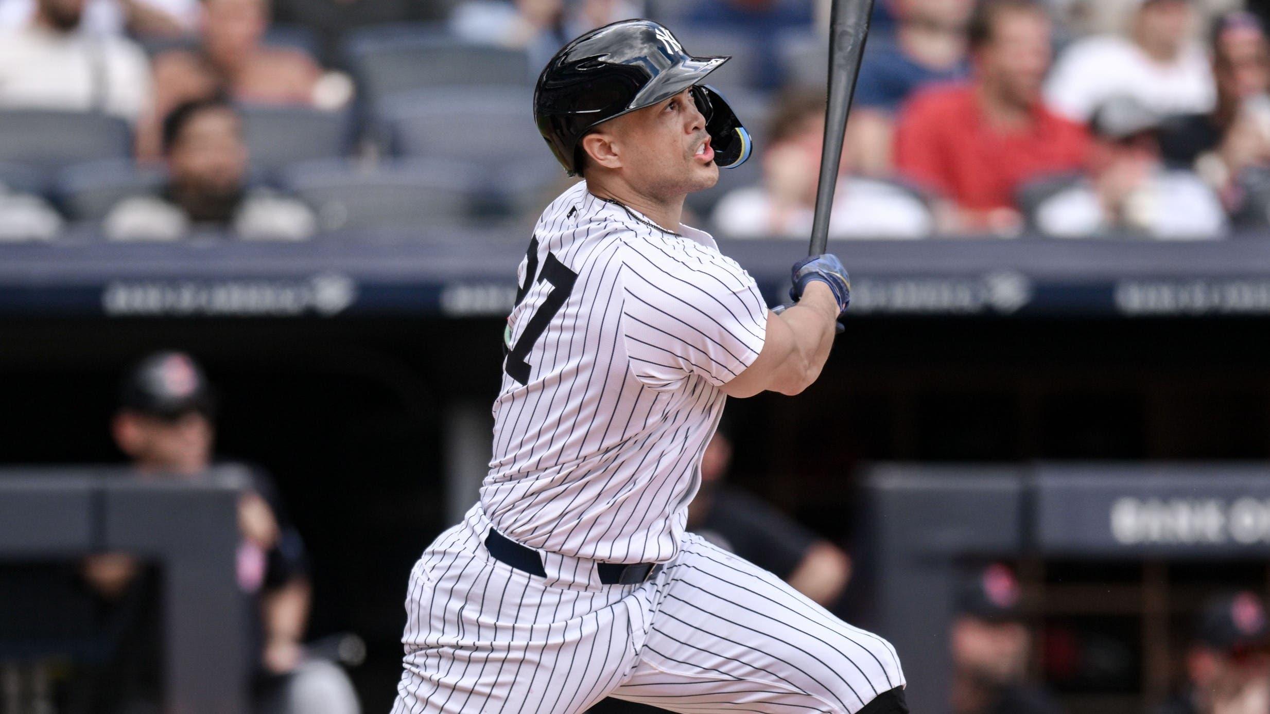 Aug 22, 2024; Bronx, New York, USA; New York Yankees designated hitter Giancarlo Stanton (27) hits a three run home run against the Cleveland Guardians during the fifth inning at Yankee Stadium. / John Jones-USA TODAY Sports