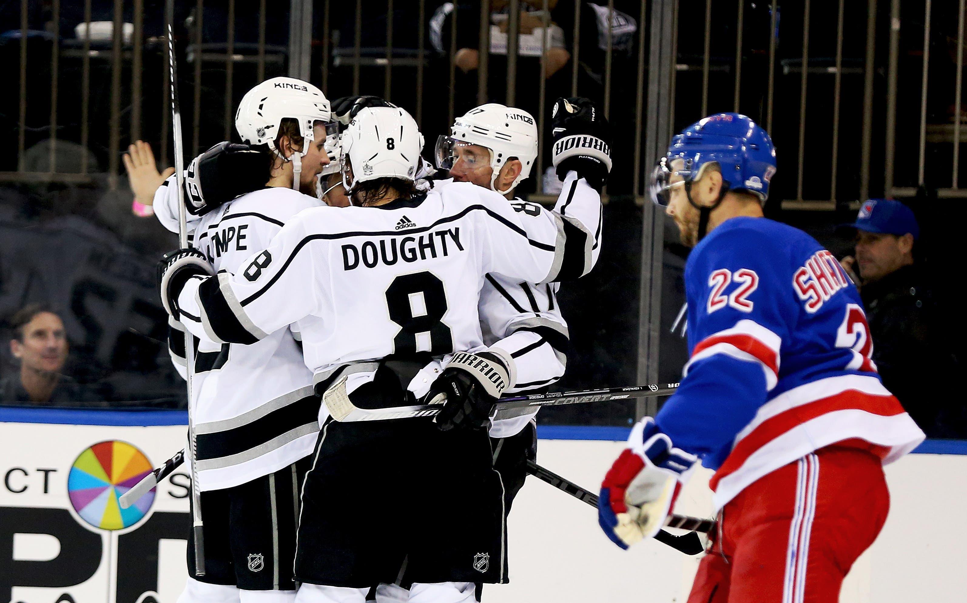 Los Angeles Kings center Adrian Kempe is congratulated after scoring a goal as New York Rangers defenseman Kevin Shattenkirk skates by during the first period at Madison Square Garden. / Andy Marlin/USA TODAY Sports