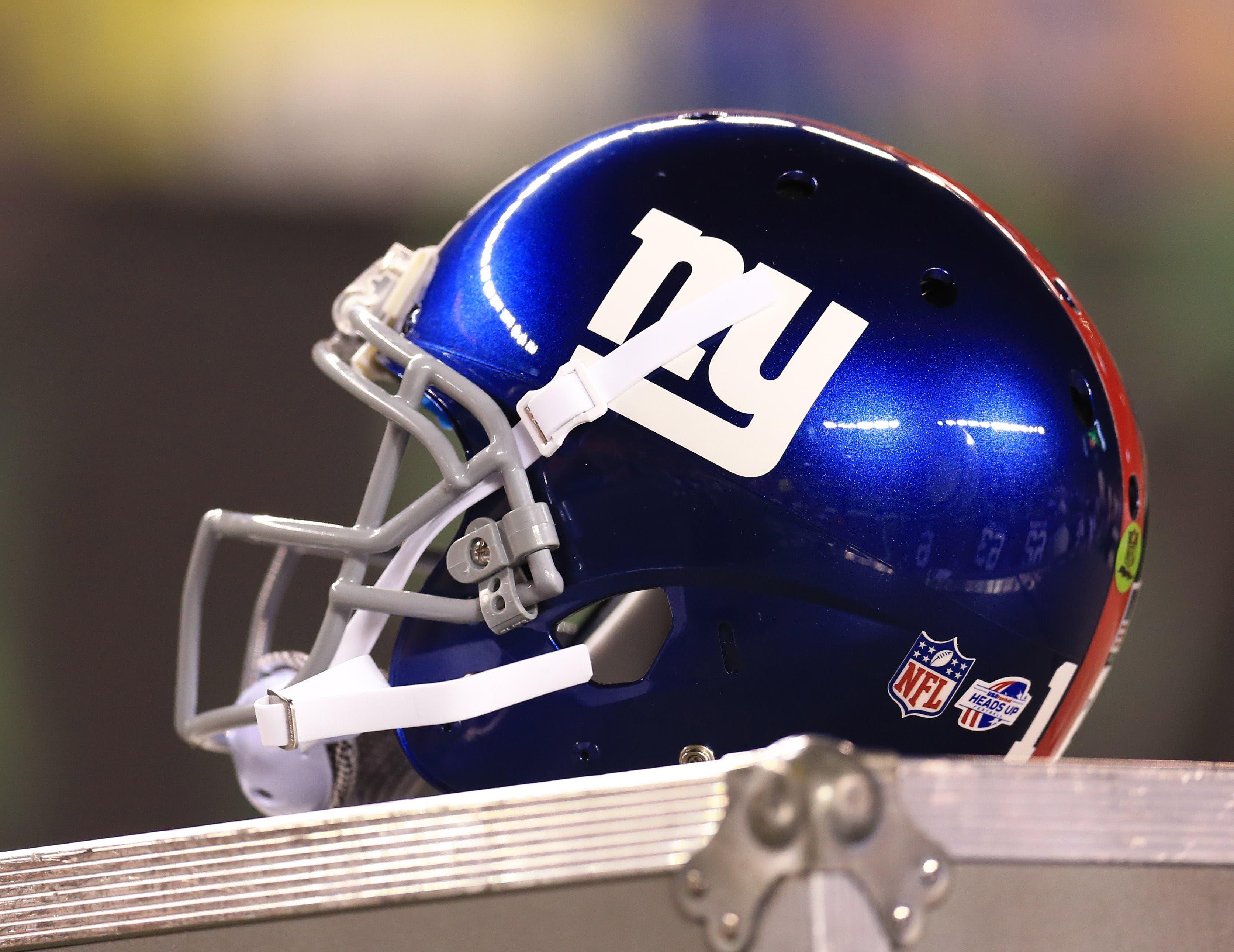 Aug 14, 2015; Cincinnati, OH, USA; Detailed view of a New York Giants helmet on the sidelines in a preseason NFL football game against the Cincinnati Bengals at Paul Brown Stadium. Mandatory Credit: Andrew Weber-USA TODAY Sports / Andrew Weber