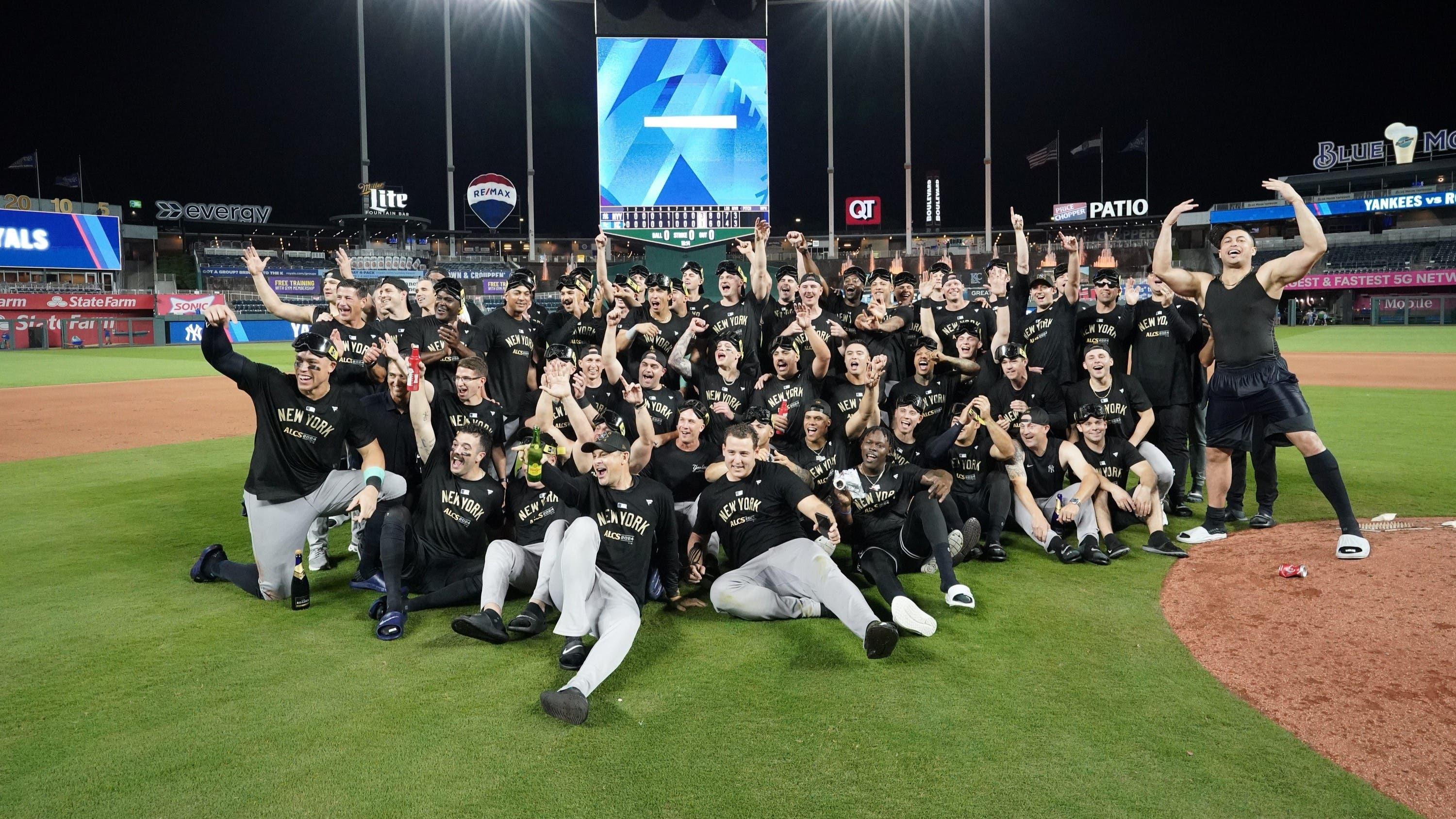 Oct 10, 2024; Kansas City, Missouri, USA; New York Yankees celebrate on the field following a win over the Kansas City Royals during game four of the ALDS for the 2024 MLB Playoffs at Kauffman Stadium.