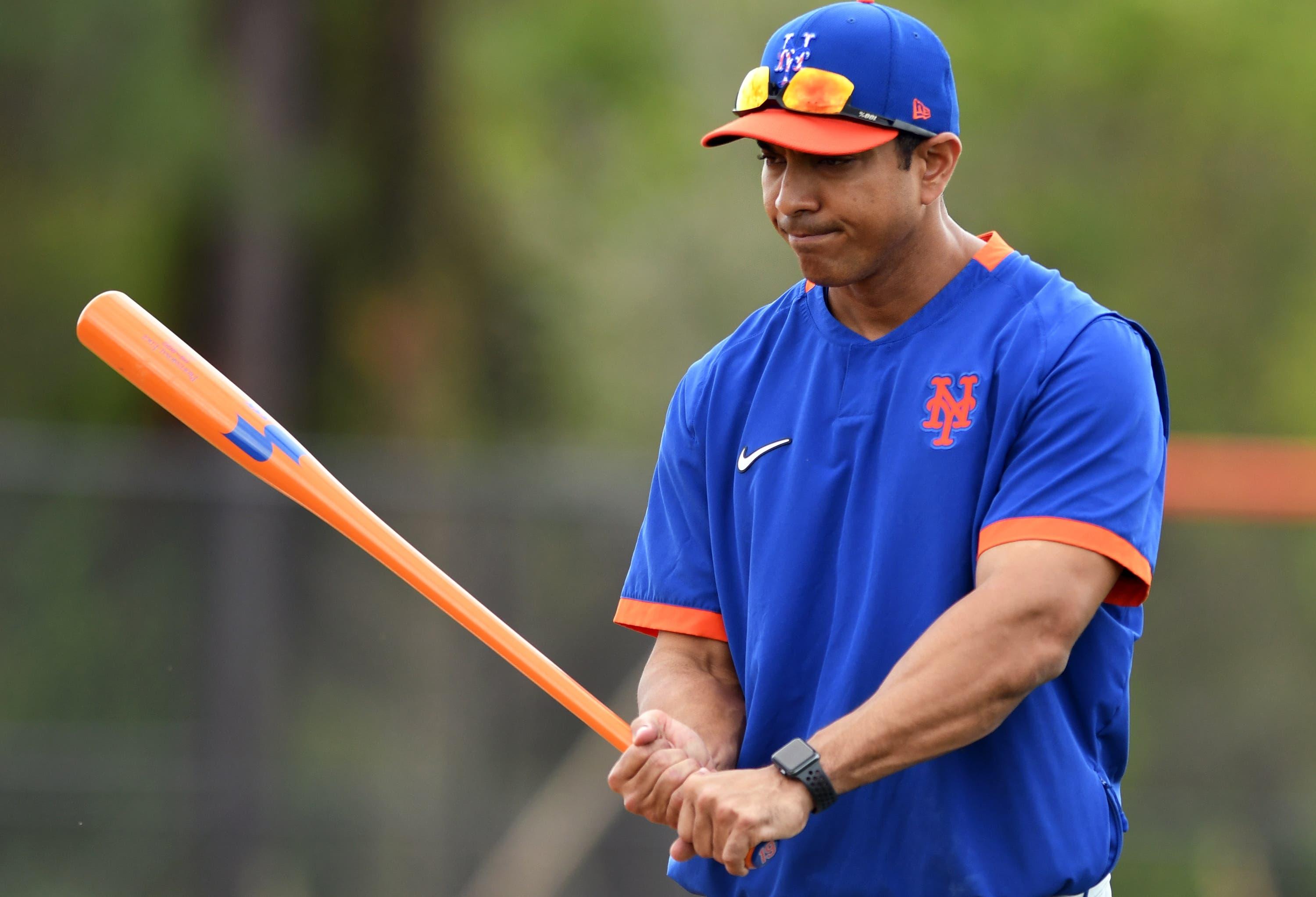 Feb 18, 2020; Port St. Lucie, Florida, USA; New York Mets manager Luis Rojas swings a bat between workout stations at spring training. Mandatory Credit: Jim Rassol-USA TODAY Sports / Jim Rassol