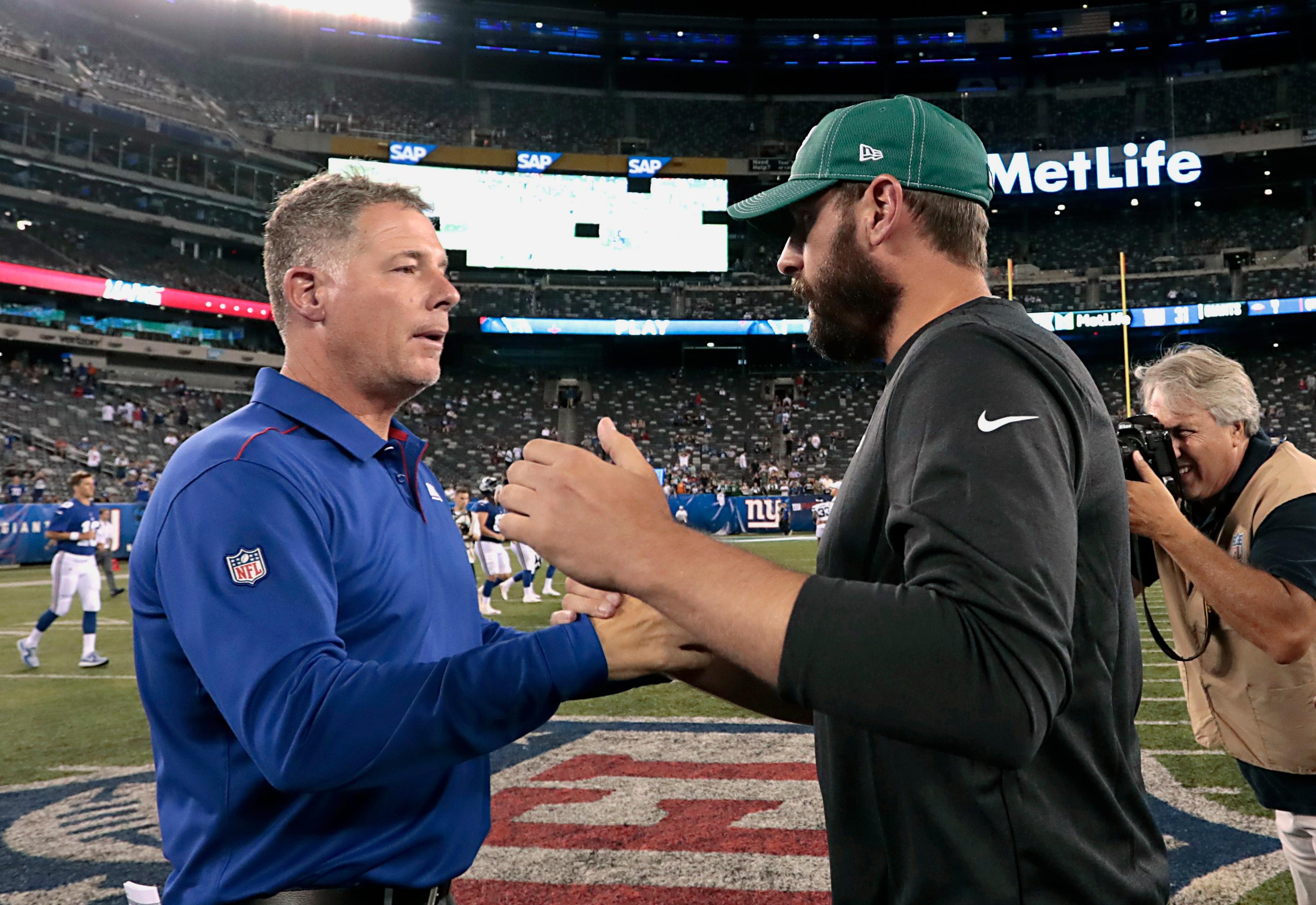 New York Giants head coach Pat Shurmur (left) shakes with New York Jets head coach Adam Gase after a game at MetLife Stadium. Mandatory Credit: Vincent Carchietta-USA TODAY Sports