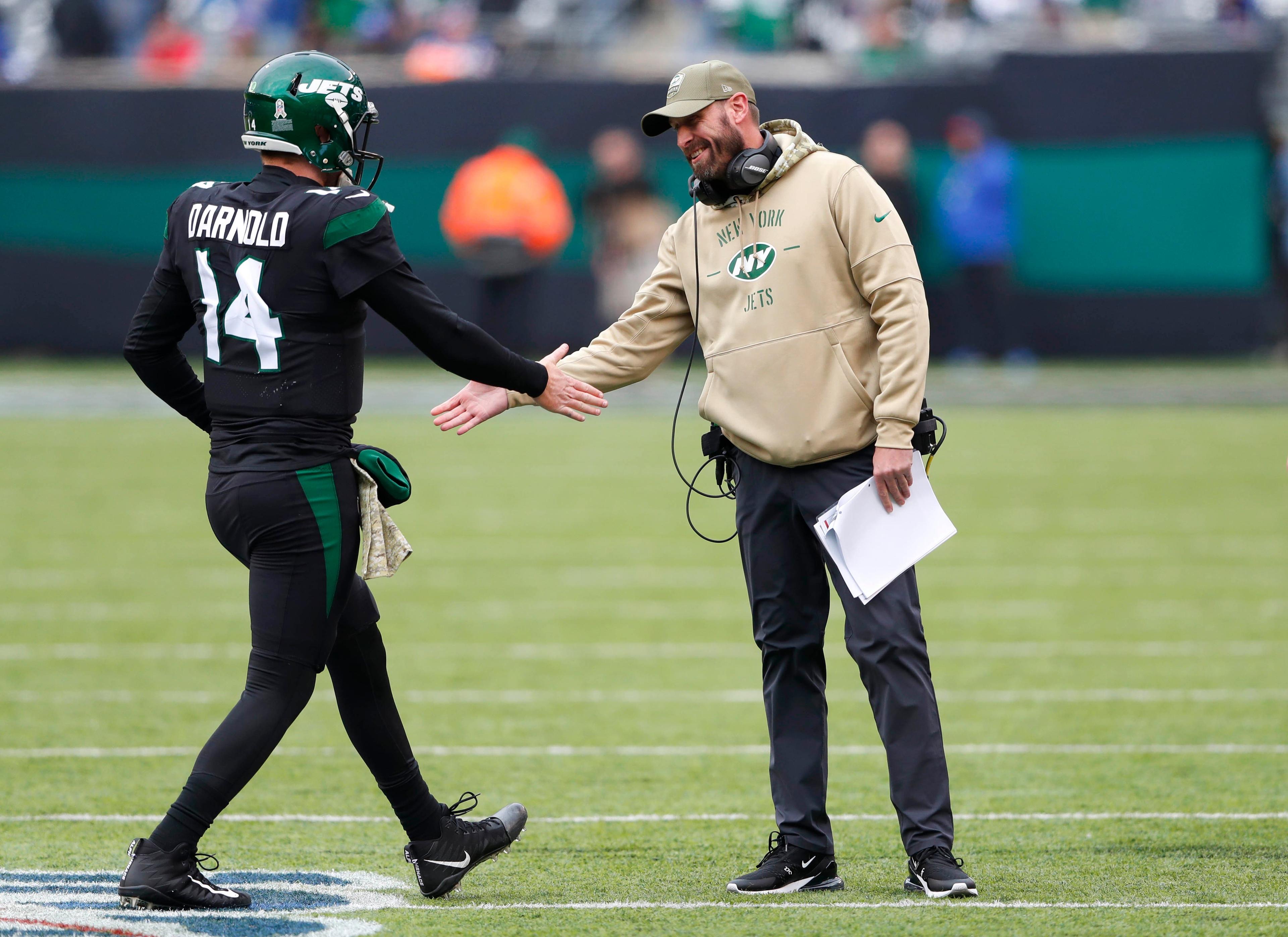 Nov 10, 2019; East Rutherford, NJ, USA; New York Jets head coach Adam Gase and New York Jets quarterback Sam Darnold (14) shake hands after a touchdown against the New York Giants during the first quarter at MetLife Stadium. Mandatory Credit: Noah K. Murray-USA TODAY Sports / Noah K. Murray