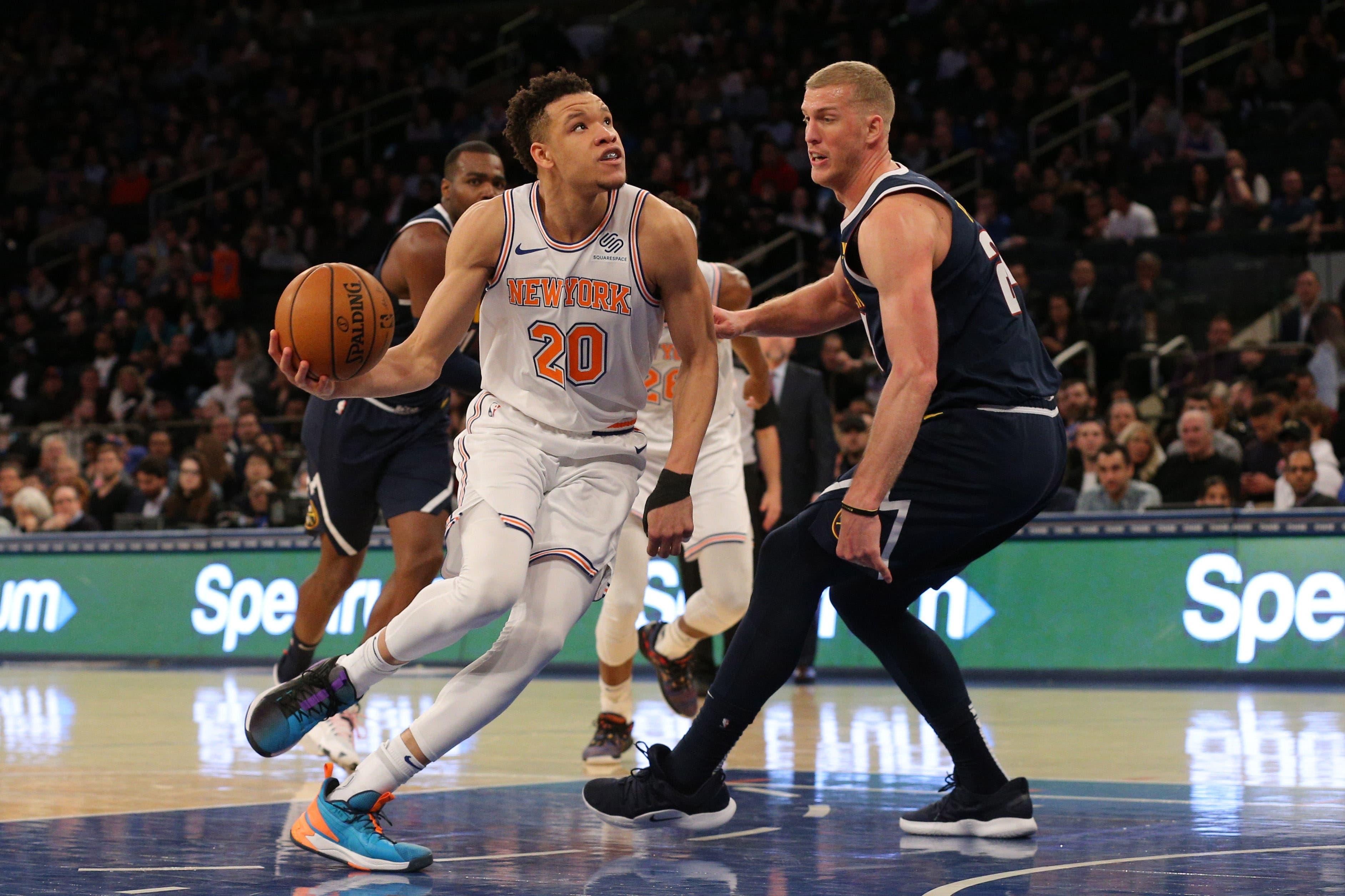 Mar 22, 2019; New York, NY, USA; New York Knicks small forward Kevin Knox (20) drives to the basket against Denver Nuggets power forward Mason Plumlee (24) during the fourth quarter at Madison Square Garden. Mandatory Credit: Brad Penner-USA TODAY Sports / Brad Penner