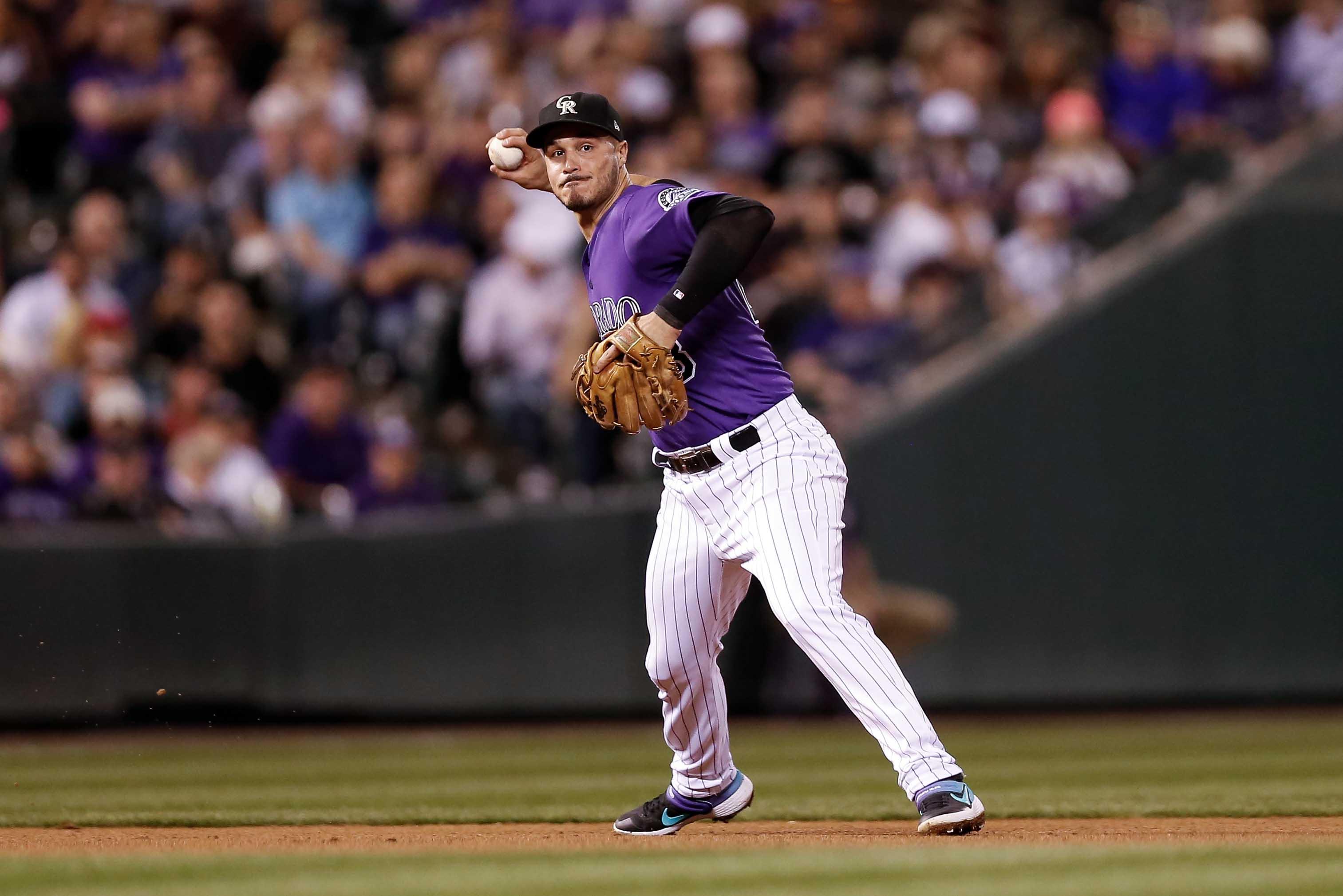 Sep 29, 2018; Denver, CO, USA; Colorado Rockies third baseman Nolan Arenado (28) fields and throws to first for an out in the fourth inning against the Washington Nationals at Coors Field. Mandatory Credit: Isaiah J. Downing-USA TODAY Sports / Isaiah J. Downing