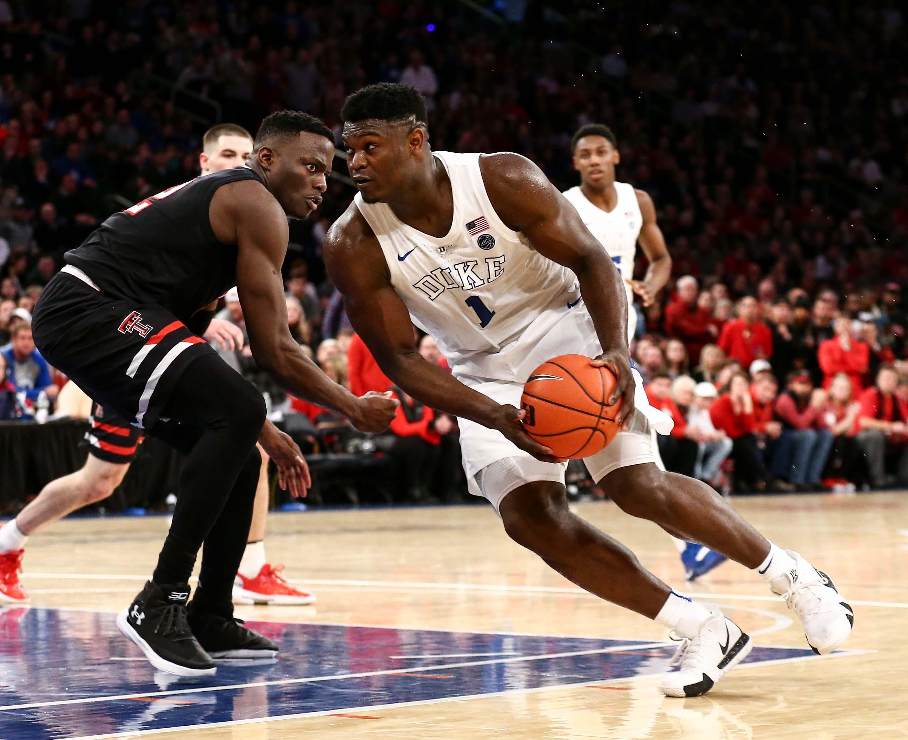 Dec 20, 2018; New York, NY, USA; Duke Blue Devils forward Zion Williamson (1) drives to the basket against Texas Tech Red Raiders center Norense Odiase (32) in the second half of the Ameritas Insurance Classic at Madison Square Garden. Mandatory Credit: Nicole Sweet-USA TODAY Sports / Nicole Sweet