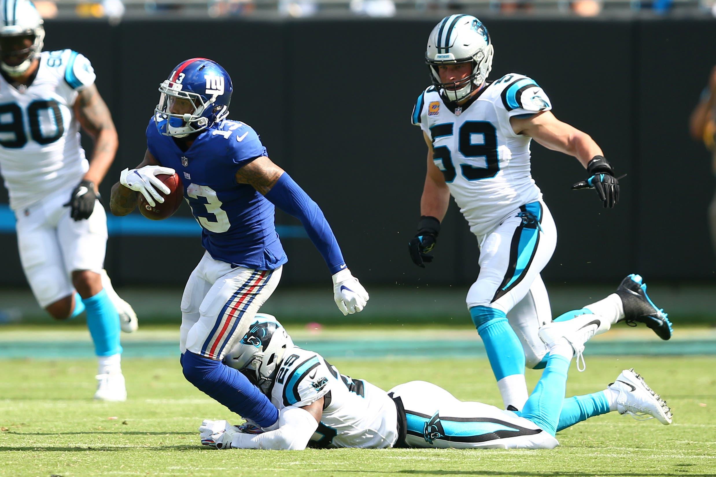 Oct 7, 2018; Charlotte, NC, USA; New York Giants wide receiver Odell Beckham (13) carries the ball past Carolina Panthers free safety Mike Adams (29) in the third quarter at Bank of America Stadium. Mandatory Credit: Jeremy Brevard-USA TODAY Sports / Jeremy Brevard