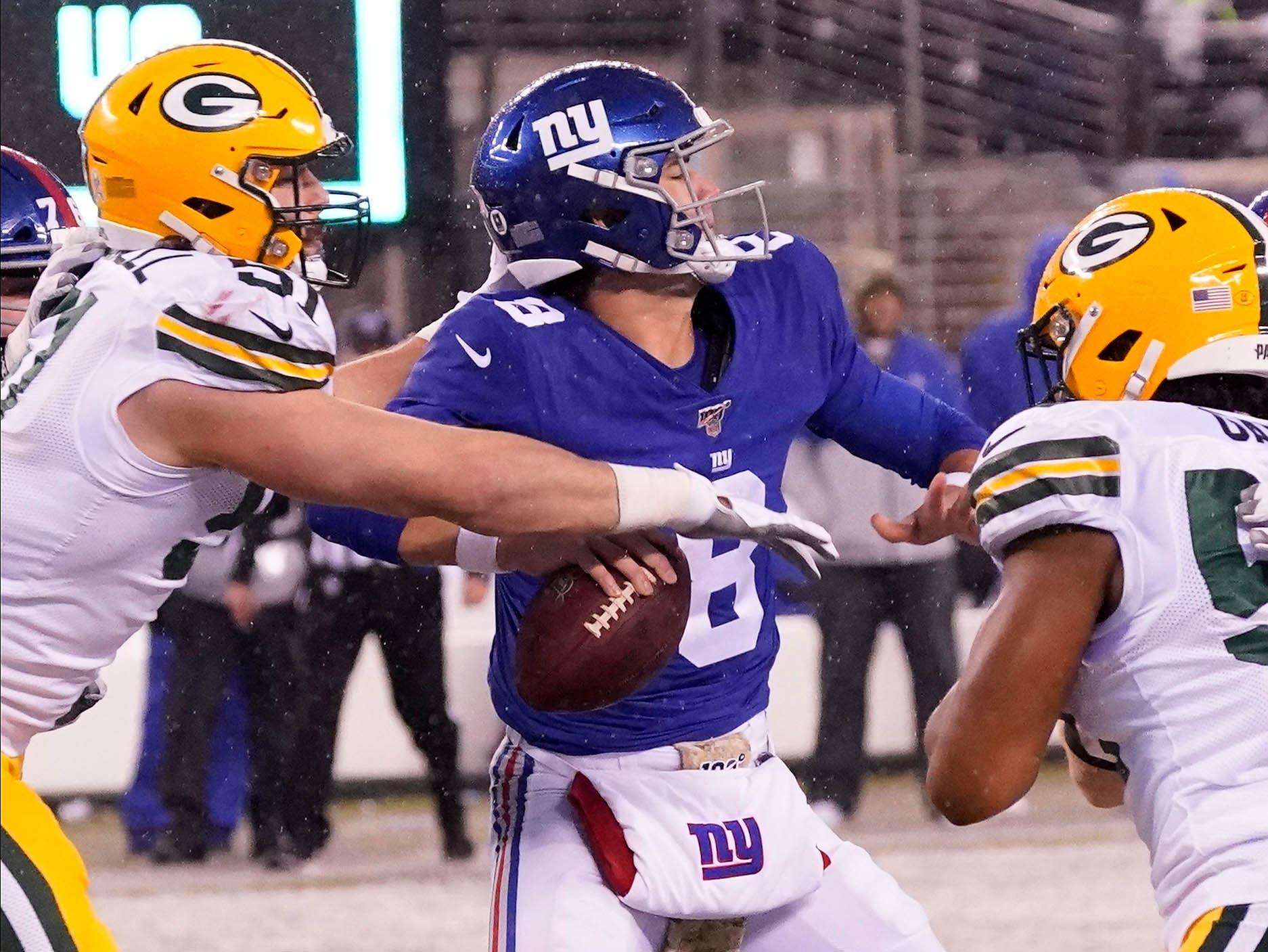 Dec 1, 2019; East Rutherford, NJ, USA; 
New York Giants quarterback Daniel Jones (8) under pressure from the Packers in the fourth quarter at MetLife Stadium. Mandatory Credit: Robert Deutsch-USA TODAY Sports / Robert Deutsch