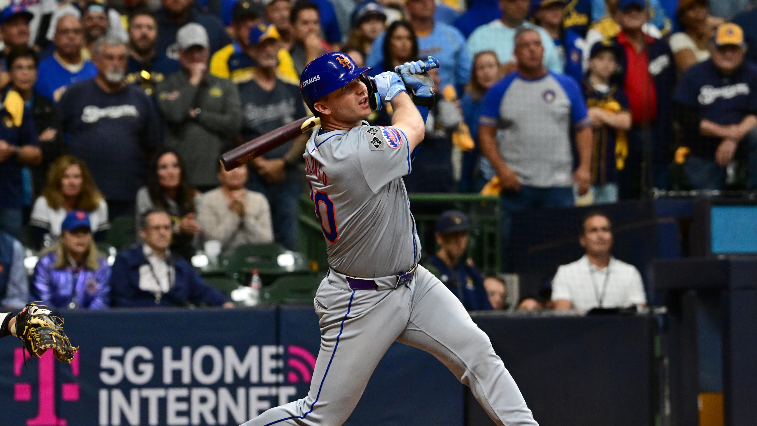 Oct 3, 2024; Milwaukee, Wisconsin, USA; New York Mets first baseman Pete Alonso (20) hits a three run home run against the Milwaukee Brewers in the ninth inning during game three of the Wildcard round for the 2024 MLB Playoffs at American Family Field. Mandatory Credit: Benny Sieu-Imagn Images