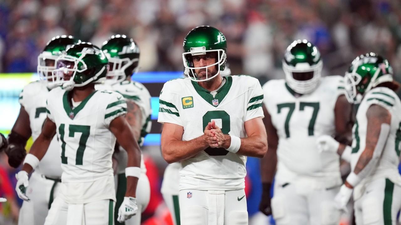 New York Jets quarterback Aaron Rodgers (8) walks out onto the field with the offense to face the Buffalo Bills in the home opener at MetLife Stadium on Monday, Sept. 11, 2023, in East Rutherford.
