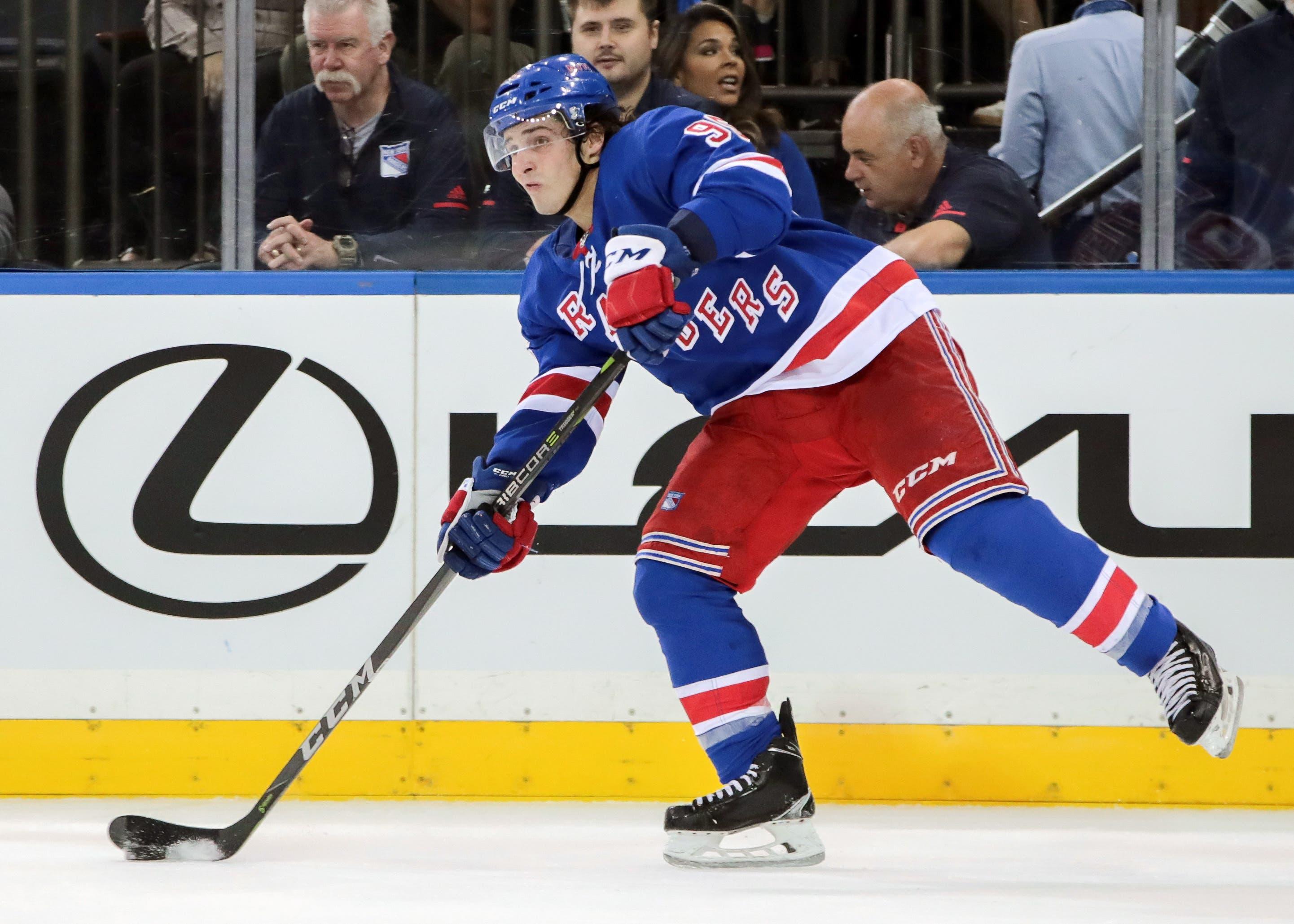 Sep 25, 2017; New York, NY, USA; New York Rangers center Vinni Lettieri (95) passes the puck against the Philadelphia Flyers during the first period at Madison Square Garden. Mandatory Credit: Vincent Carchietta-USA TODAY Sports / Vincent Carchietta