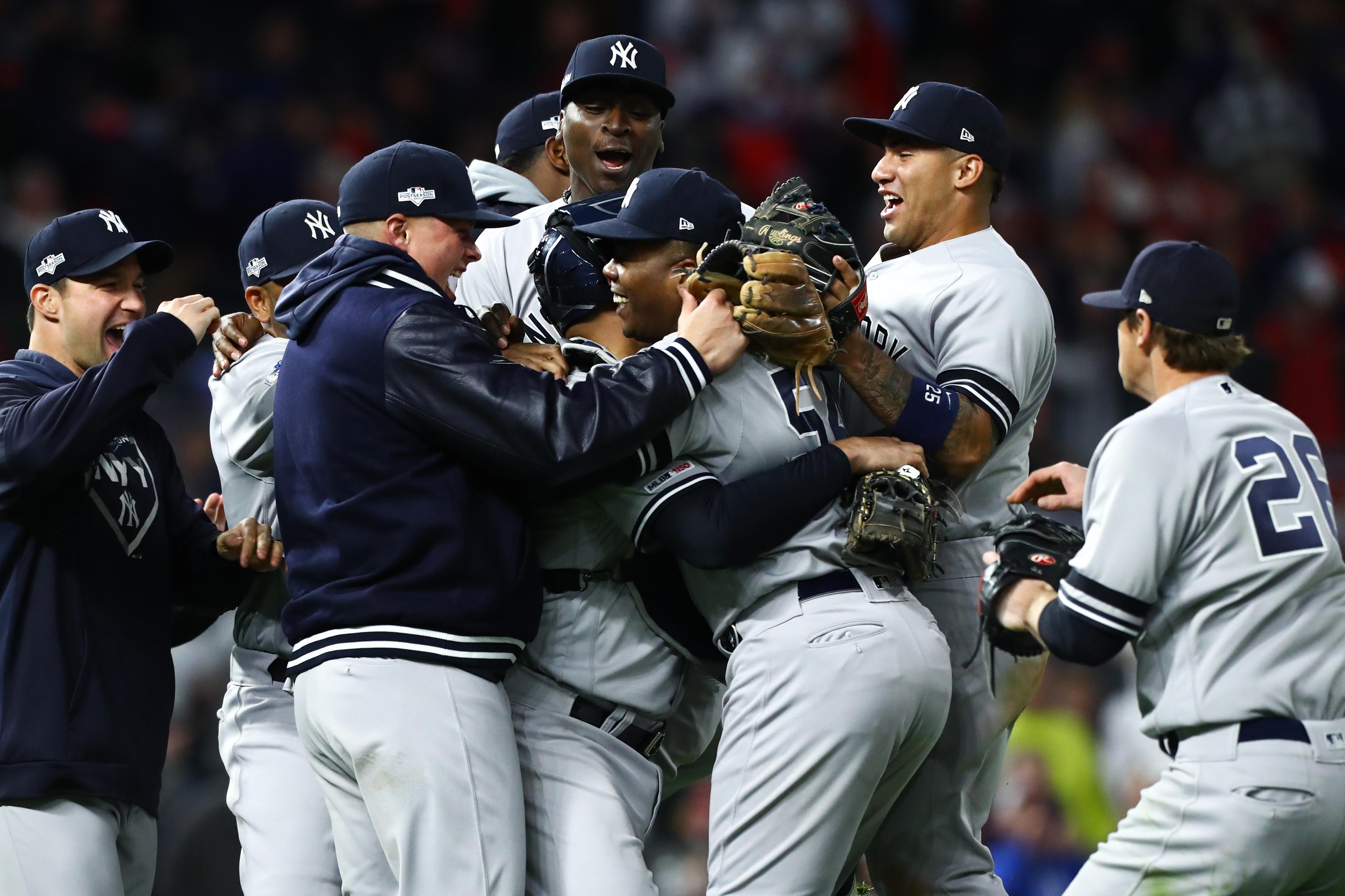 Oct 7, 2019; Minneapolis, MN, USA; New York Yankees players celebrate with relief pitcher Aroldis Chapman (54) after defeating the Minnesota Twins during the ninth inning of game three of the 2019 ALDS playoff baseball series at Target Field. Mandatory Credit: David Berding-USA TODAY Sports