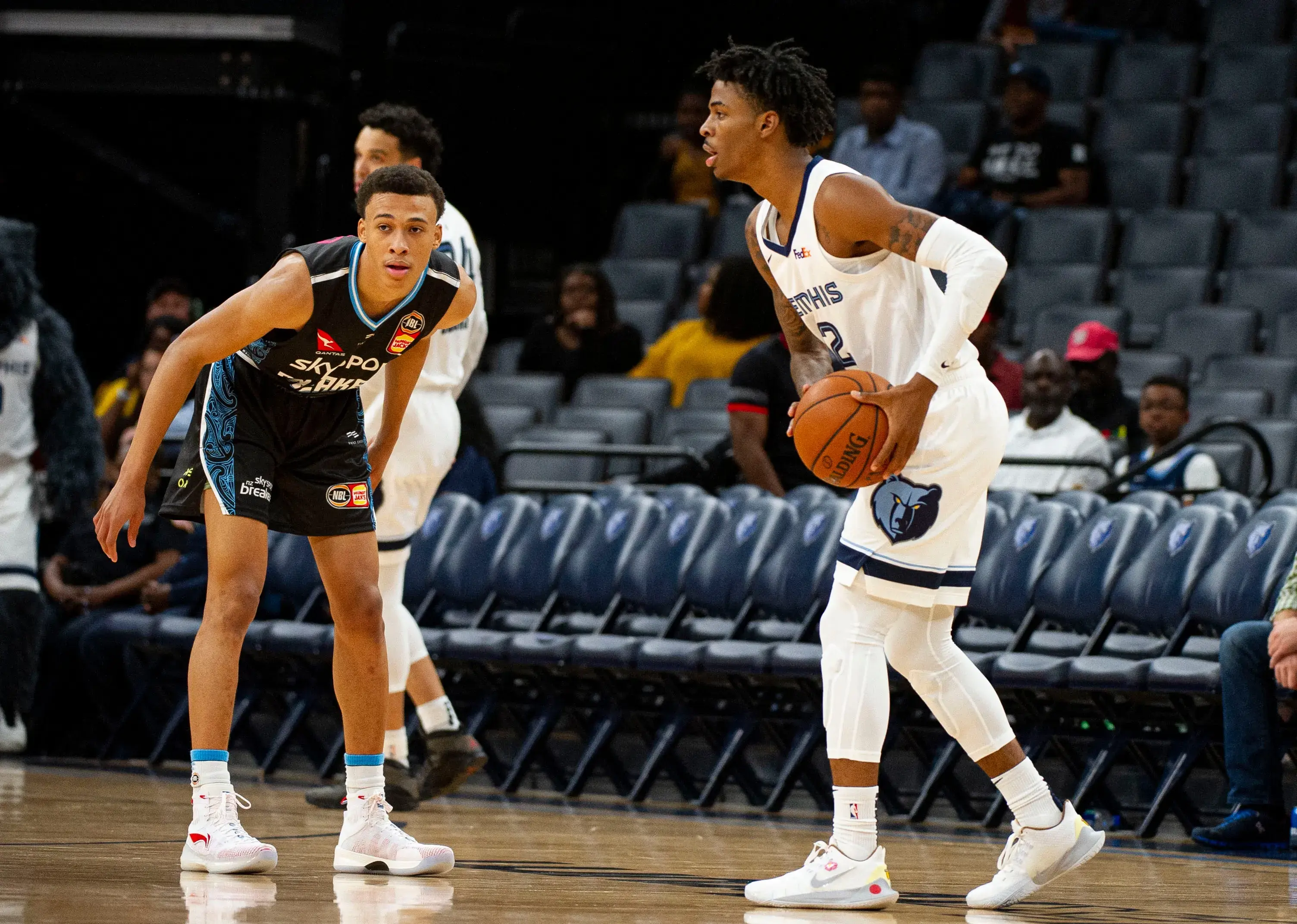 Oct 8, 2019; Memphis, TN, USA; Memphis Grizzlies guard Ja Morant (12) handles the ball against New Zealand Breakers guard R.J. Hampton (14) during the first half at FedEx Forum. / © Justin Ford-USA TODAY Sports