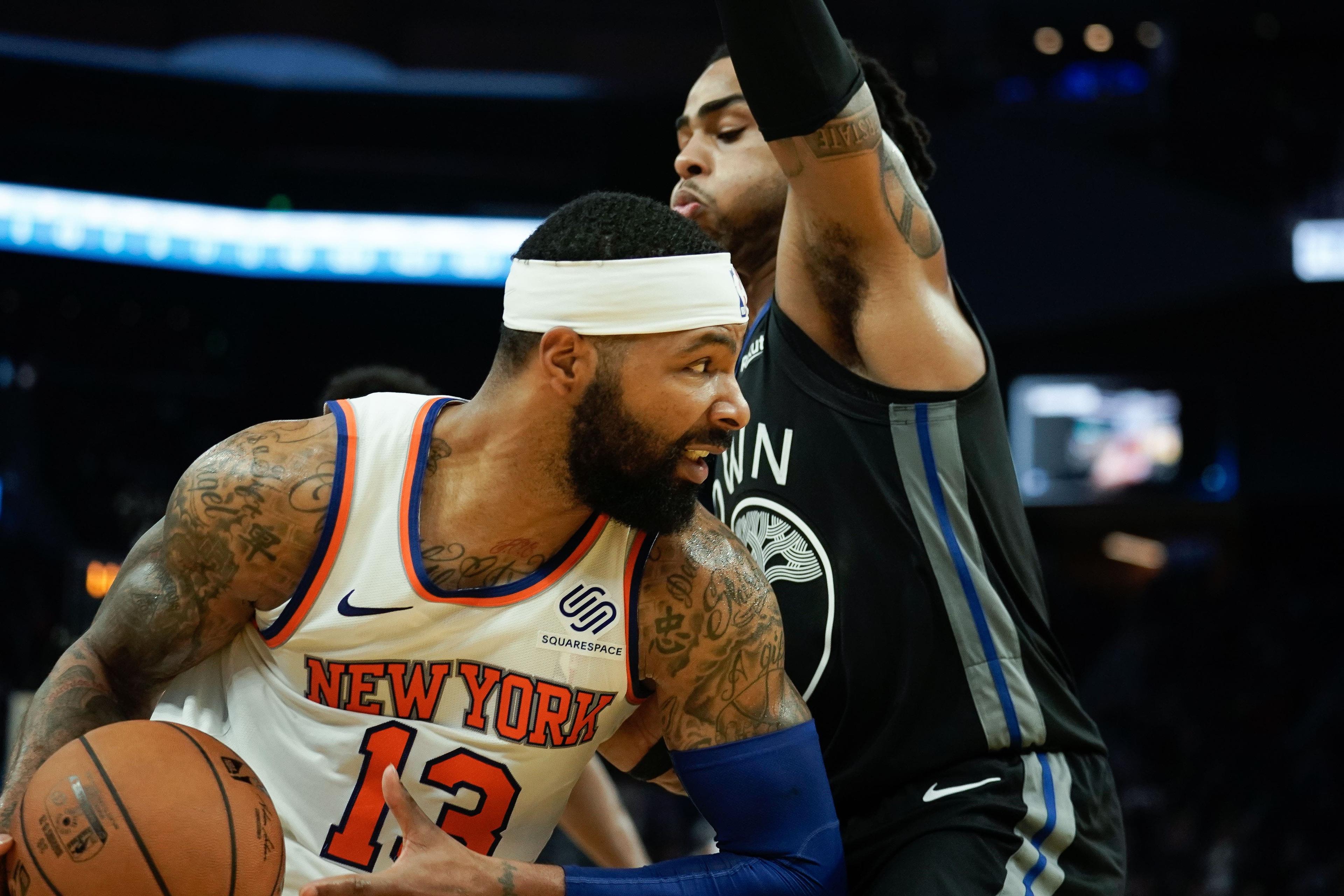 Dec 11, 2019; San Francisco, CA, USA; New York Knicks forward Marcus Morris Sr. (13) drives the ball against Golden State Warriors guard D'Angelo Russell (0) during the fourth quarter at Chase Center. Mandatory Credit: Stan Szeto-USA TODAY Sports / Stan Szeto