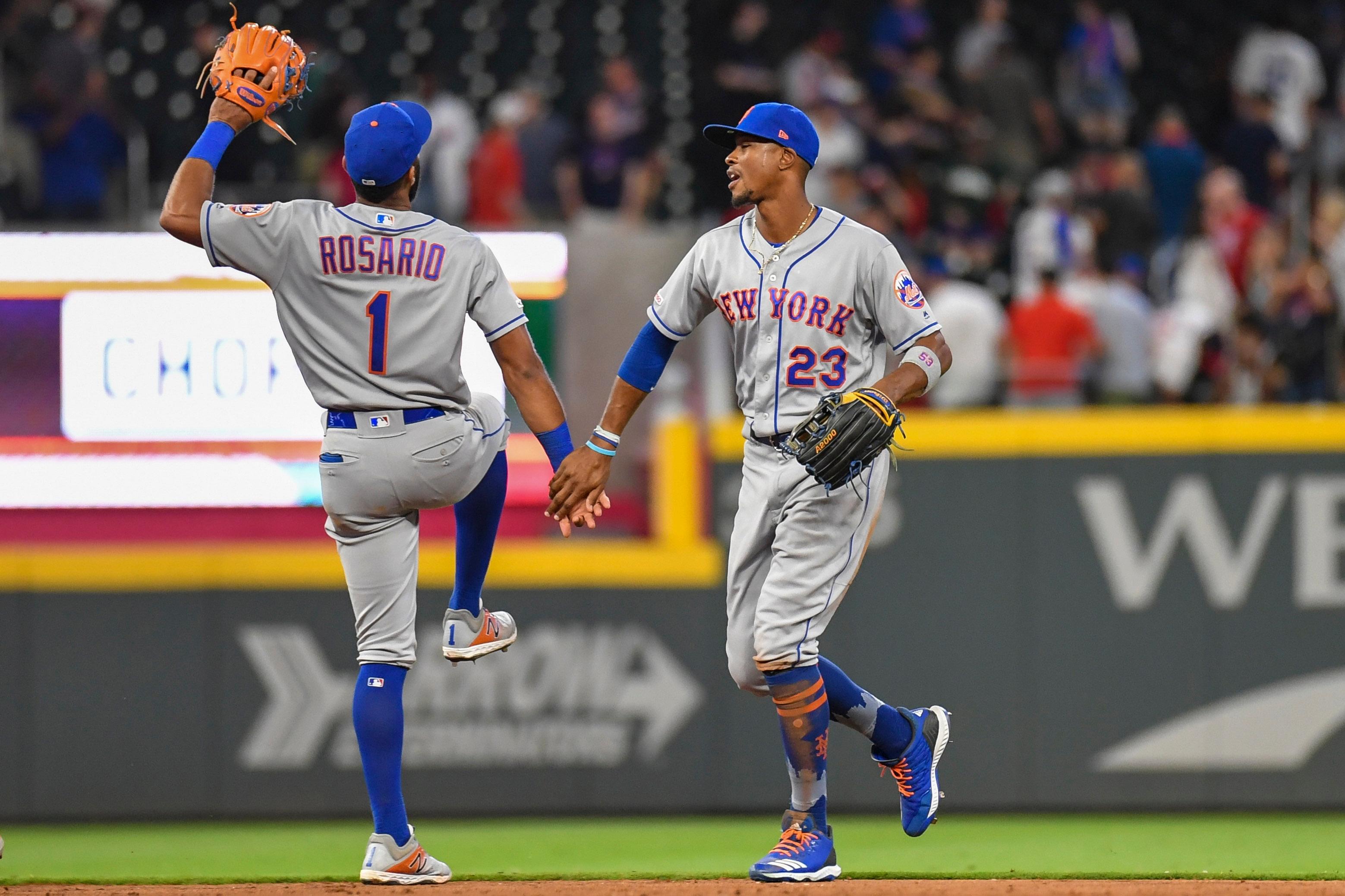 New York Mets shortstop Amed Rosario and outfielder Keon Broxton react after defeating the Atlanta Braves at SunTrust Park.