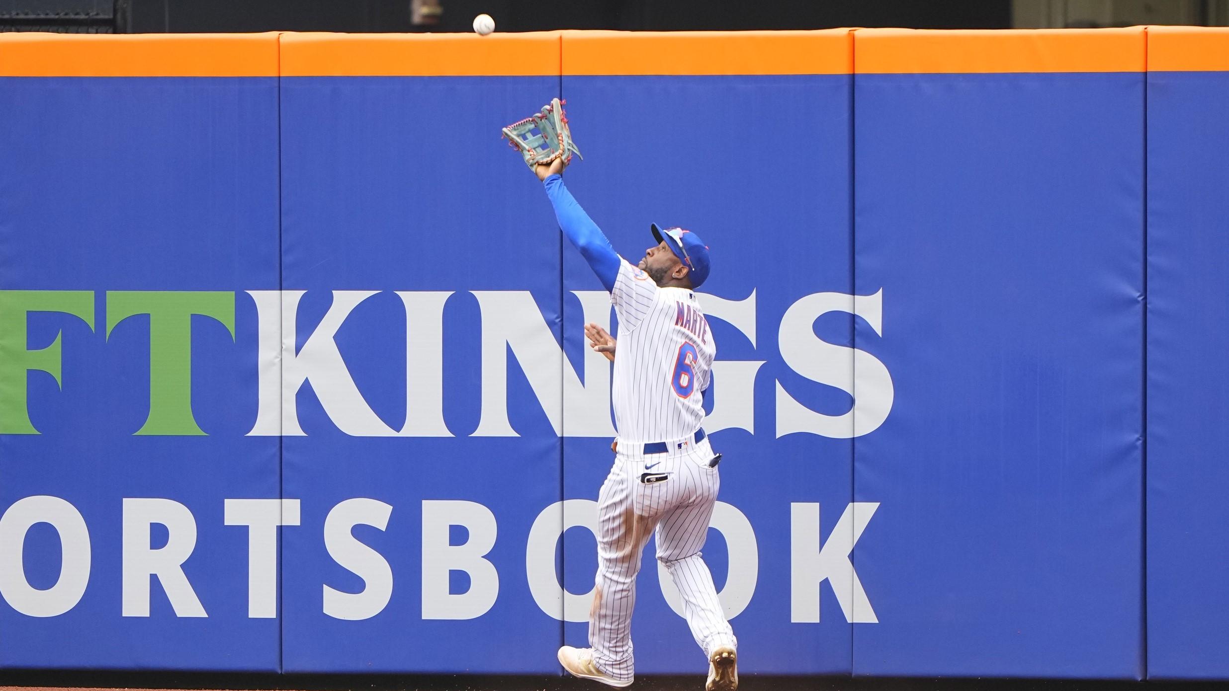 May 4, 2022; New York City, New York, USA; New York Mets right fielder Starling Marte (6) catches a fly ball hit by Atlanta Braves shortstop Dansby Swanson (7) (not pictured) during the fifth inning at Citi Field. / Gregory Fisher-USA TODAY Sports