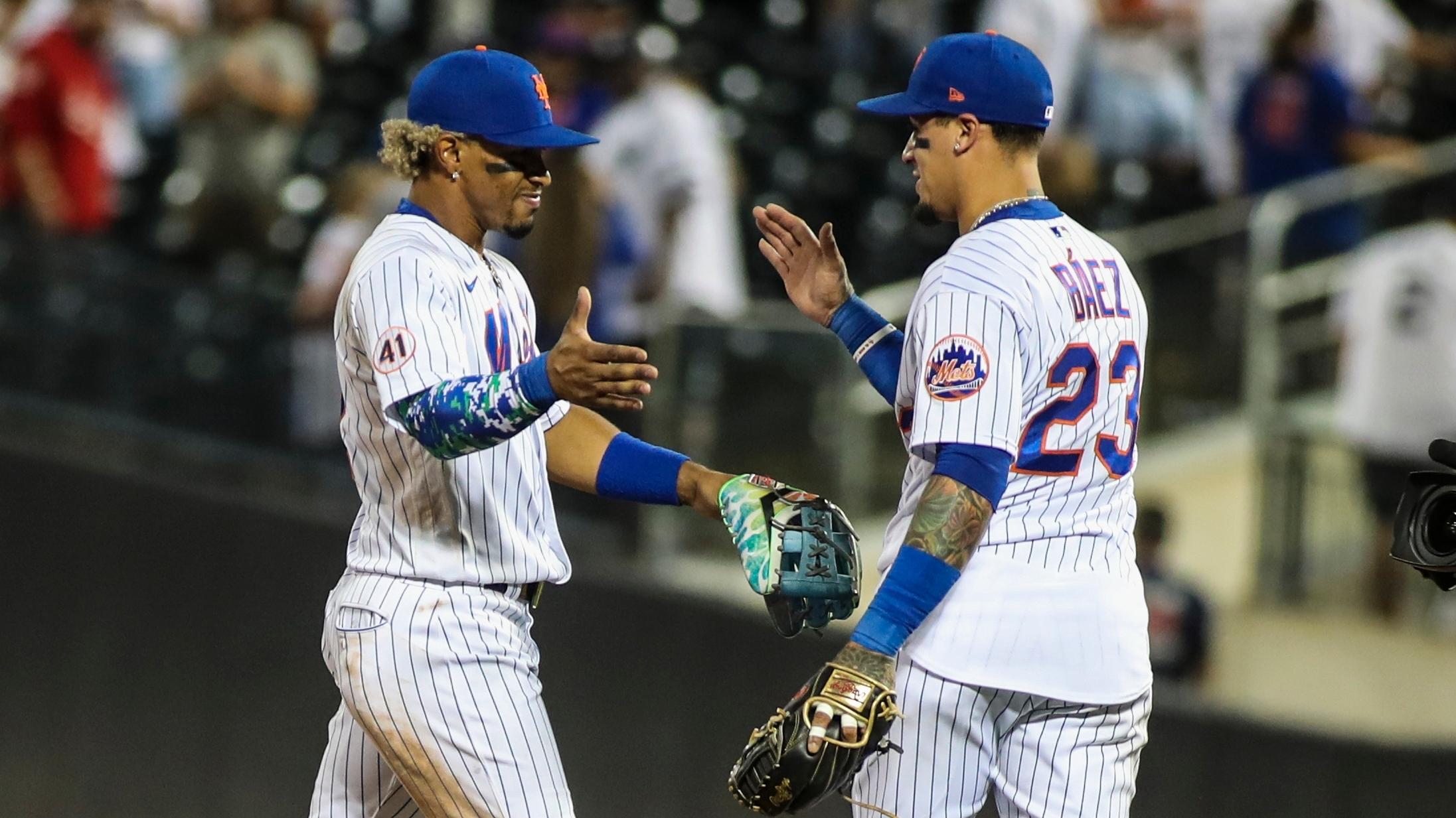 Sep 12, 2021; New York City, New York, USA; New York Mets shortstop Francisco Lindor(12) and second baseman Javier Baez (23) celebrate after defeating the New York Yankees 7-6 at Citi Field. / Wendell Cruz-USA TODAY Sports