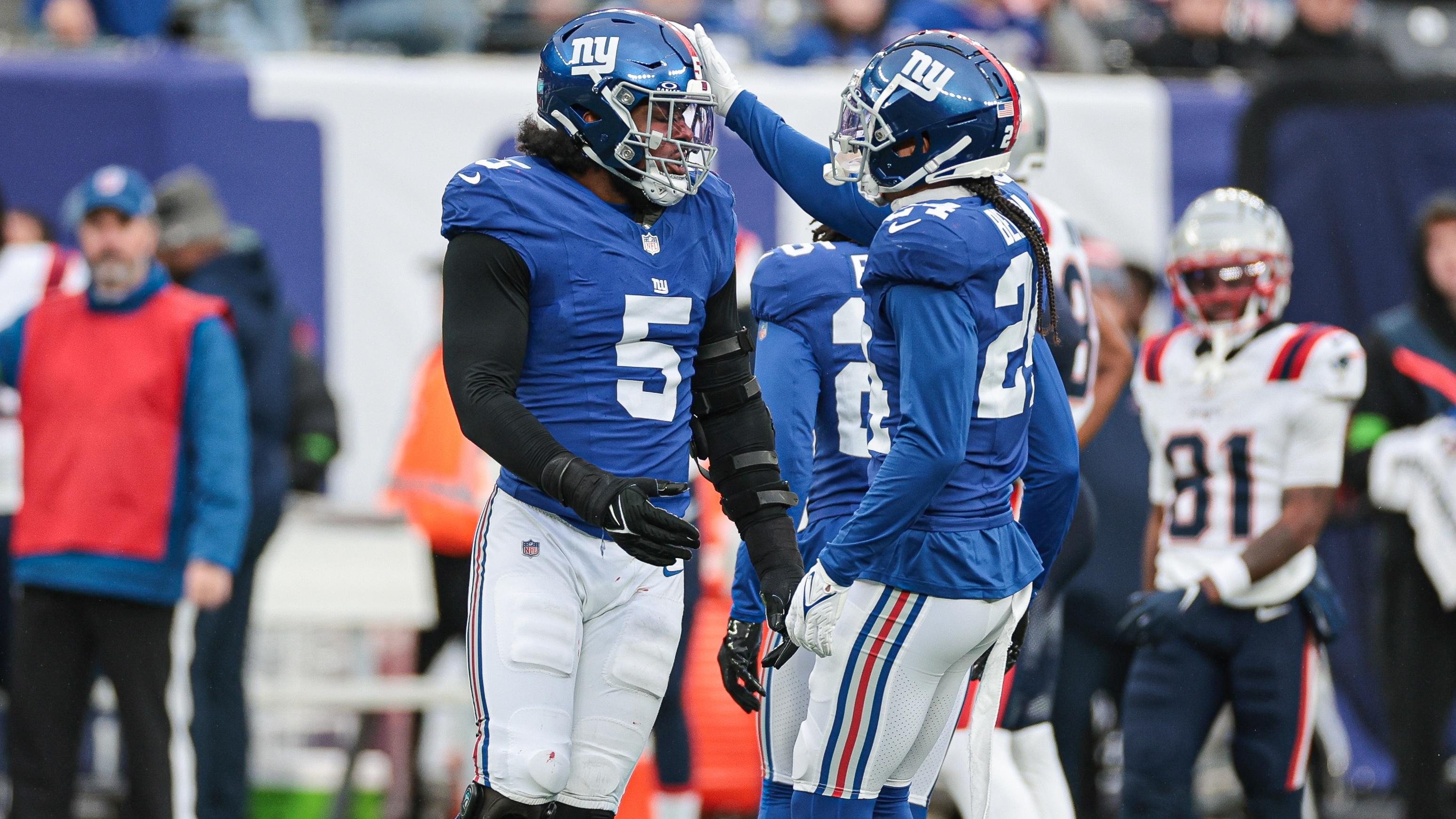 New York Giants linebacker Kayvon Thibodeaux (5) celebrates a defensive stop with safety Dane Belton (24) during the first half against the New England Patriots at MetLife Stadium / Vincent Carchietta - USA TODAY Sports
