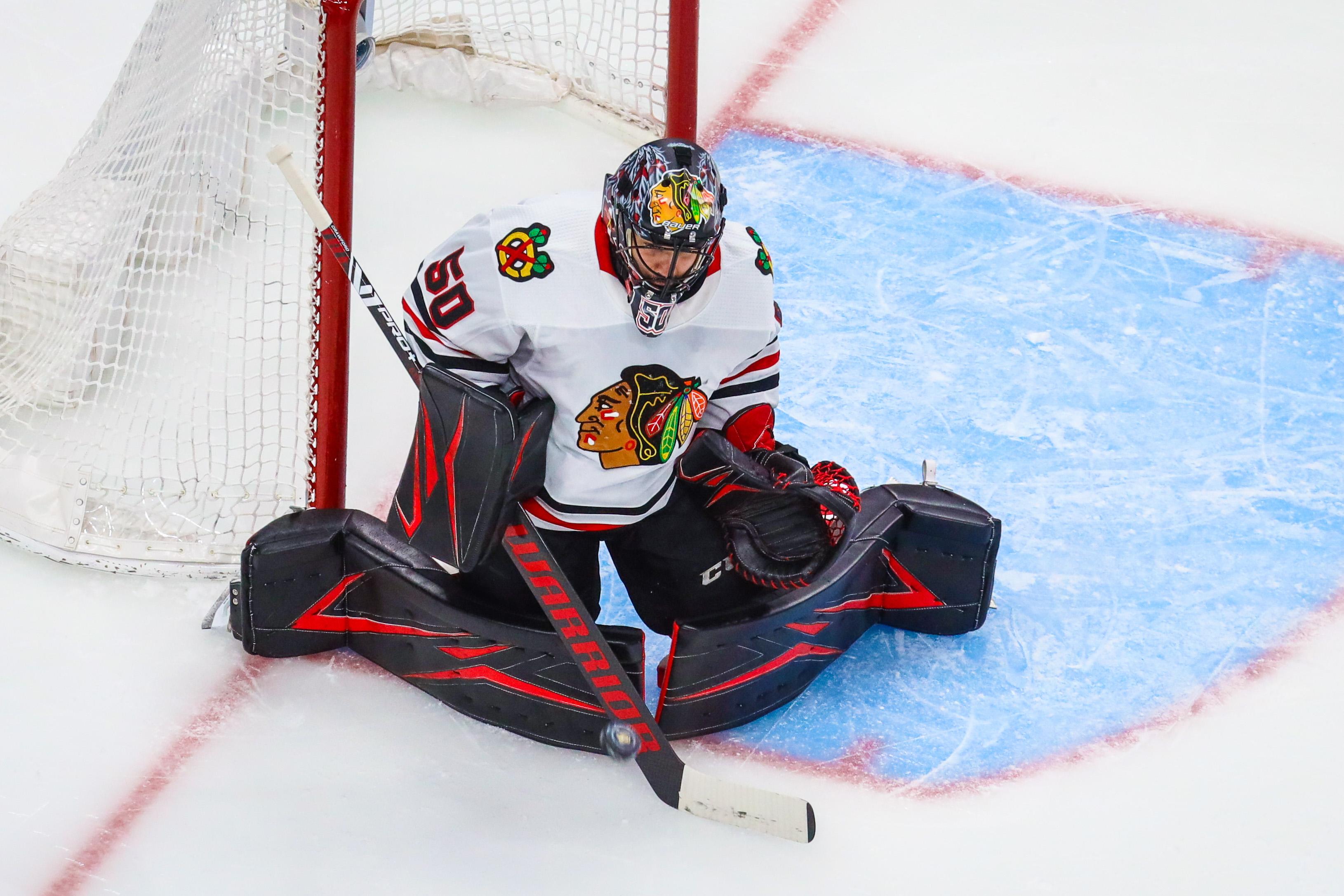 Aug 13, 2020; Edmonton, Alberta, CAN; Chicago Blackhawks goaltender Corey Crawford (50) makes a save against the Vegas Golden Knights during the first period in game two of the first round of the 2020 Stanley Cup Playoffs at Rogers Place. / Sergei Belski-USA TODAY Sports