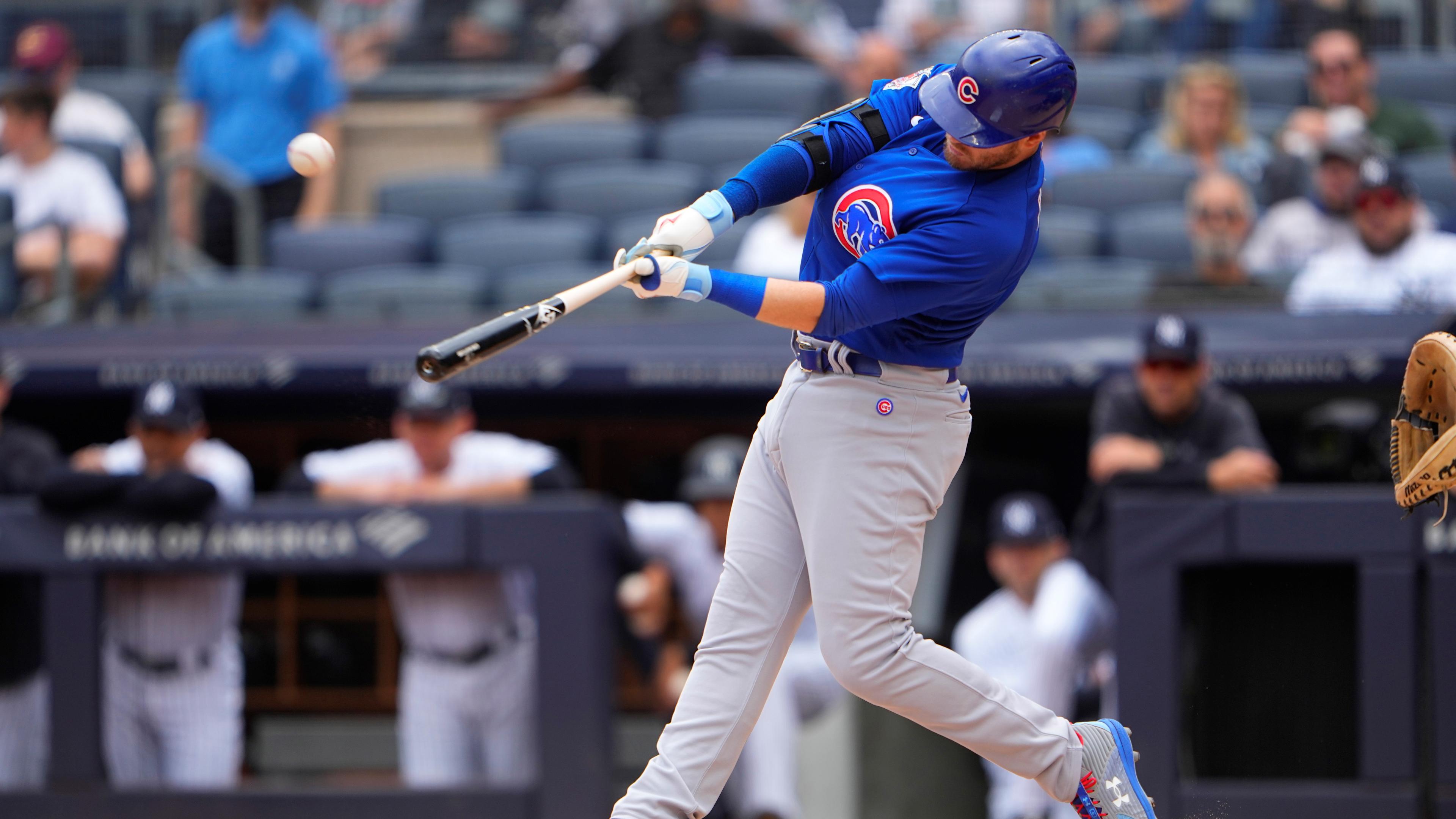 Chicago Cubs designated hitter Ian Happ (8) hits a home run against the New York Yankees during the first inning at Yankee Stadium. / Gregory Fisher-USA TODAY Sports