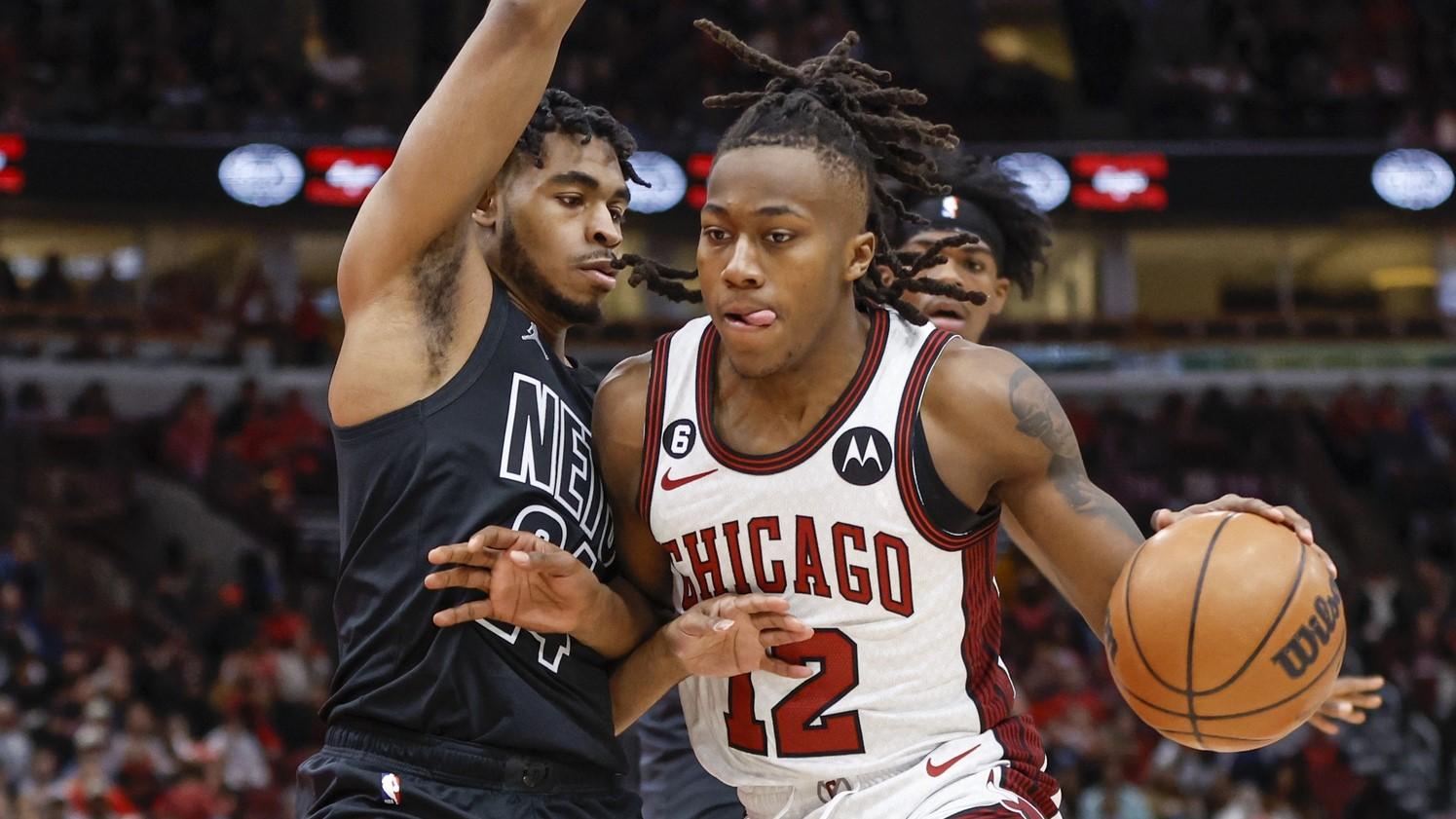 Feb 24, 2023; Chicago, Illinois, USA; Chicago Bulls guard Ayo Dosunmu (12) drives to the basket against Brooklyn Nets guard Cam Thomas (24) during the first half at United Center. / Kamil Krzaczynski-USA TODAY Sports