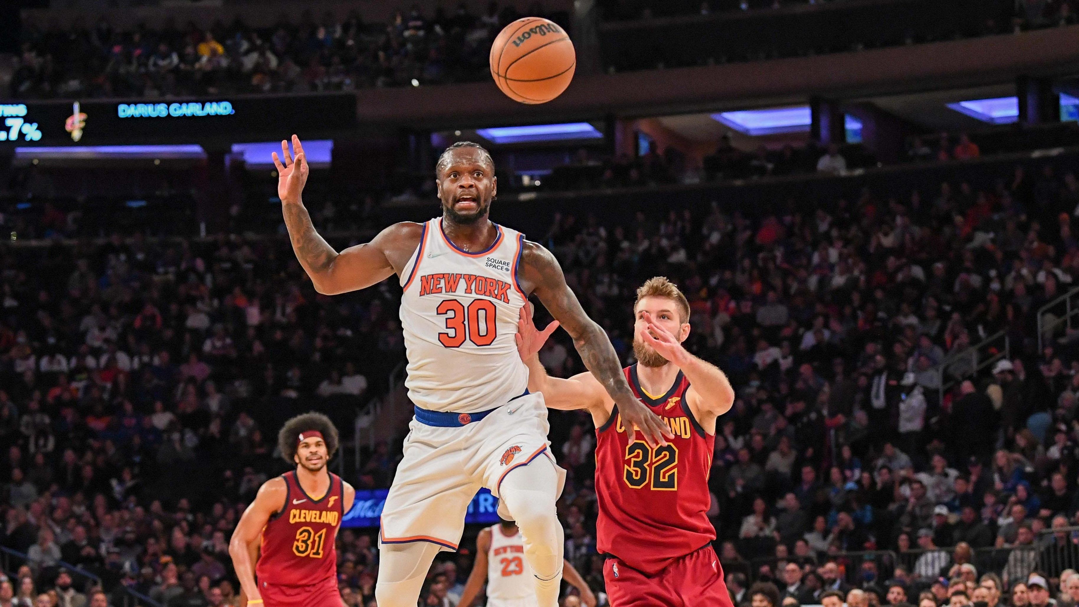 Nov 7, 2021; New York, New York, USA; New York Knicks forward Julius Randle (30) and Cleveland Cavaliers forward Dean Wade (32) go after a loose ball during the second quarter at Madison Square Garden. Mandatory Credit: Dennis Schneidler-USA TODAY Sports / © Dennis Schneidler-USA TODAY Sports