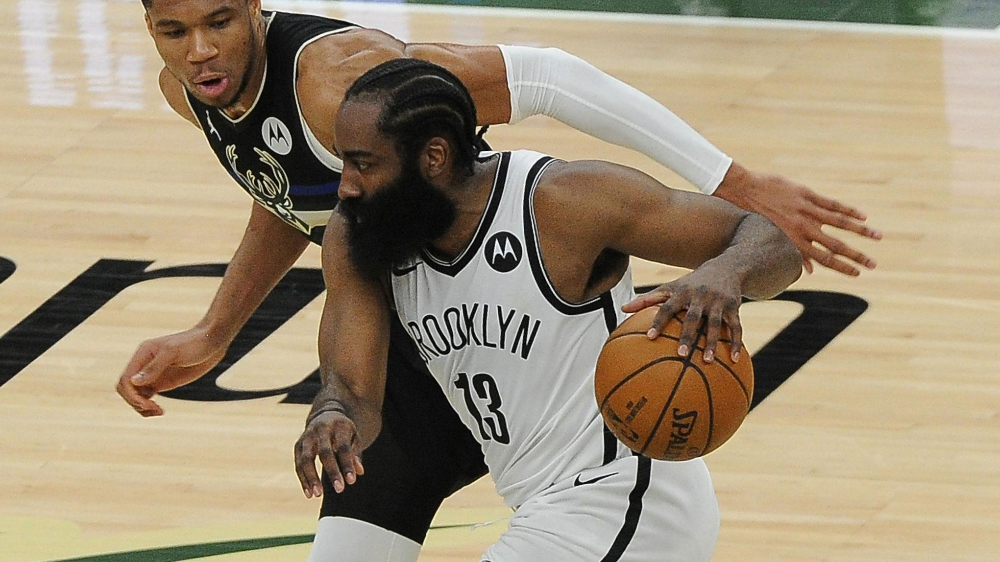 Jun 17, 2021; Milwaukee, Wisconsin, USA; Milwaukee Bucks forward Giannis Antetokounmpo (34) guards Brooklyn Nets guard James Harden (13) in the first quarter during game six in the second round of the 2021 NBA Playoffs at Fiserv Forum. / Michael McLoone-USA TODAY Sports
