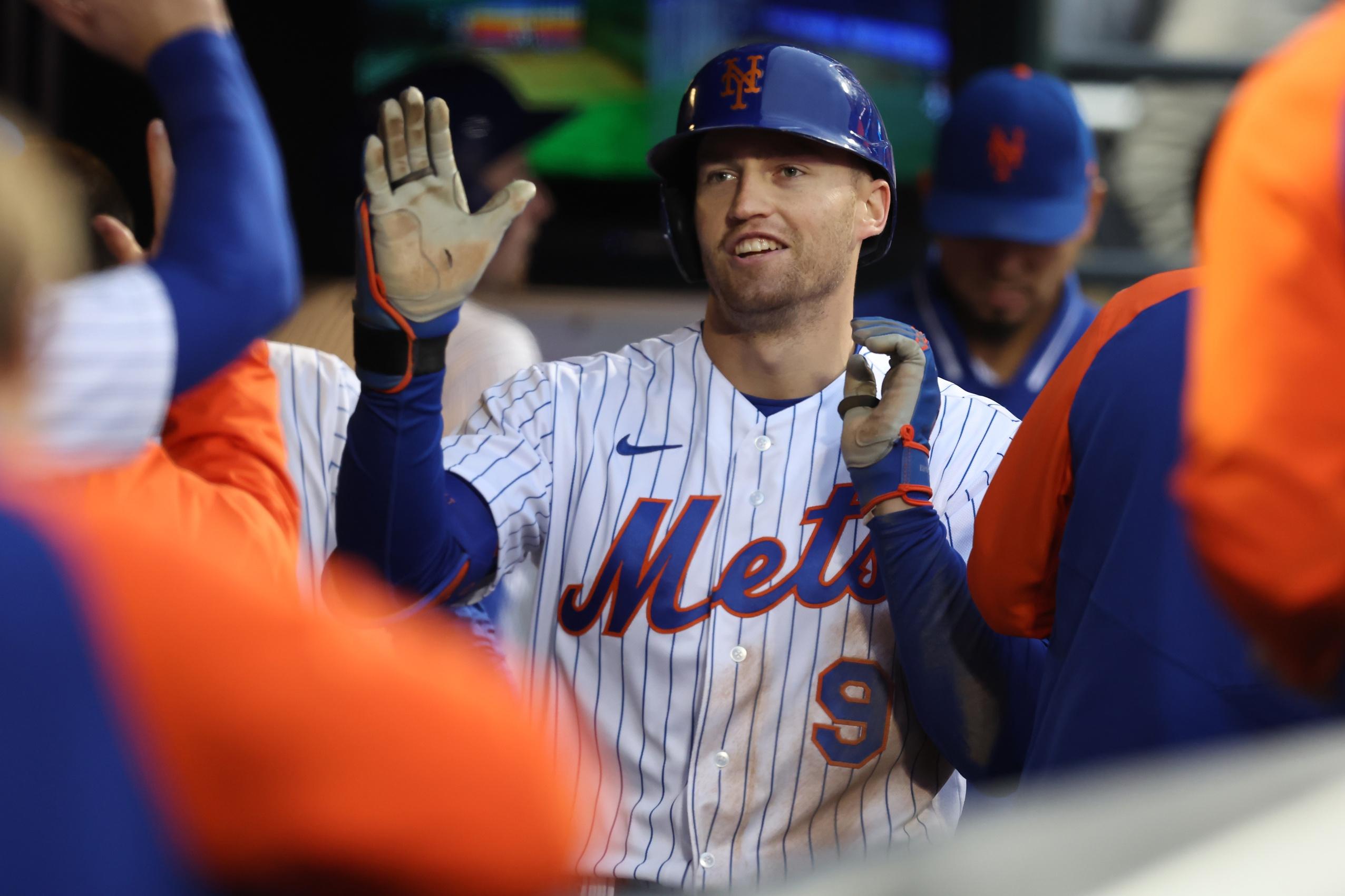 New York Mets center fielder Brandon Nimmo (9) celebrates his solo home run against the Washington Nationals with teammates in the dugout during the fourth inning at Citi Field. / Brad Penner-USA TODAY Sports