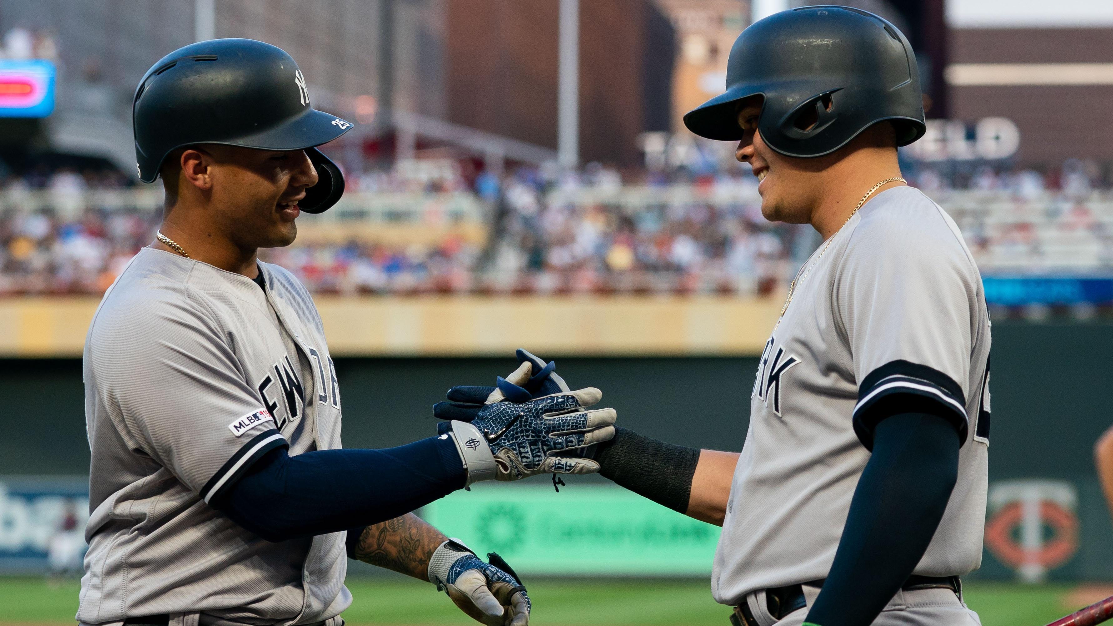 Jul 24, 2019; Minneapolis, MN, USA; New York Yankees second baseman Gleyber Torres (25) celebrates after hitting a home run with third baseman Gio Urshela (right) in the third inning against Minnesota Twins at Target Field. Mandatory Credit: Brad Rempel-USA TODAY Sports / © Brad Rempel-USA TODAY Sports
