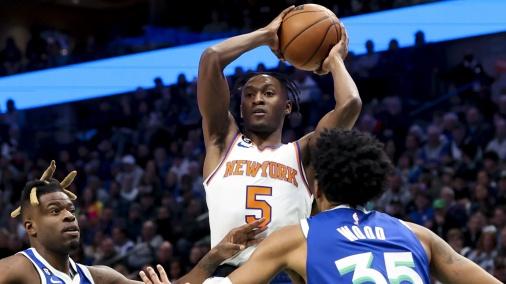 Dec 27, 2022; Dallas, Texas, USA; New York Knicks guard Immanuel Quickley (5) looks to pass over Dallas Mavericks forward Christian Wood (35) and Dallas Mavericks forward Reggie Bullock (25) during the first quarter at American Airlines Center / Kevin Jairaj - USA TODAY Sports