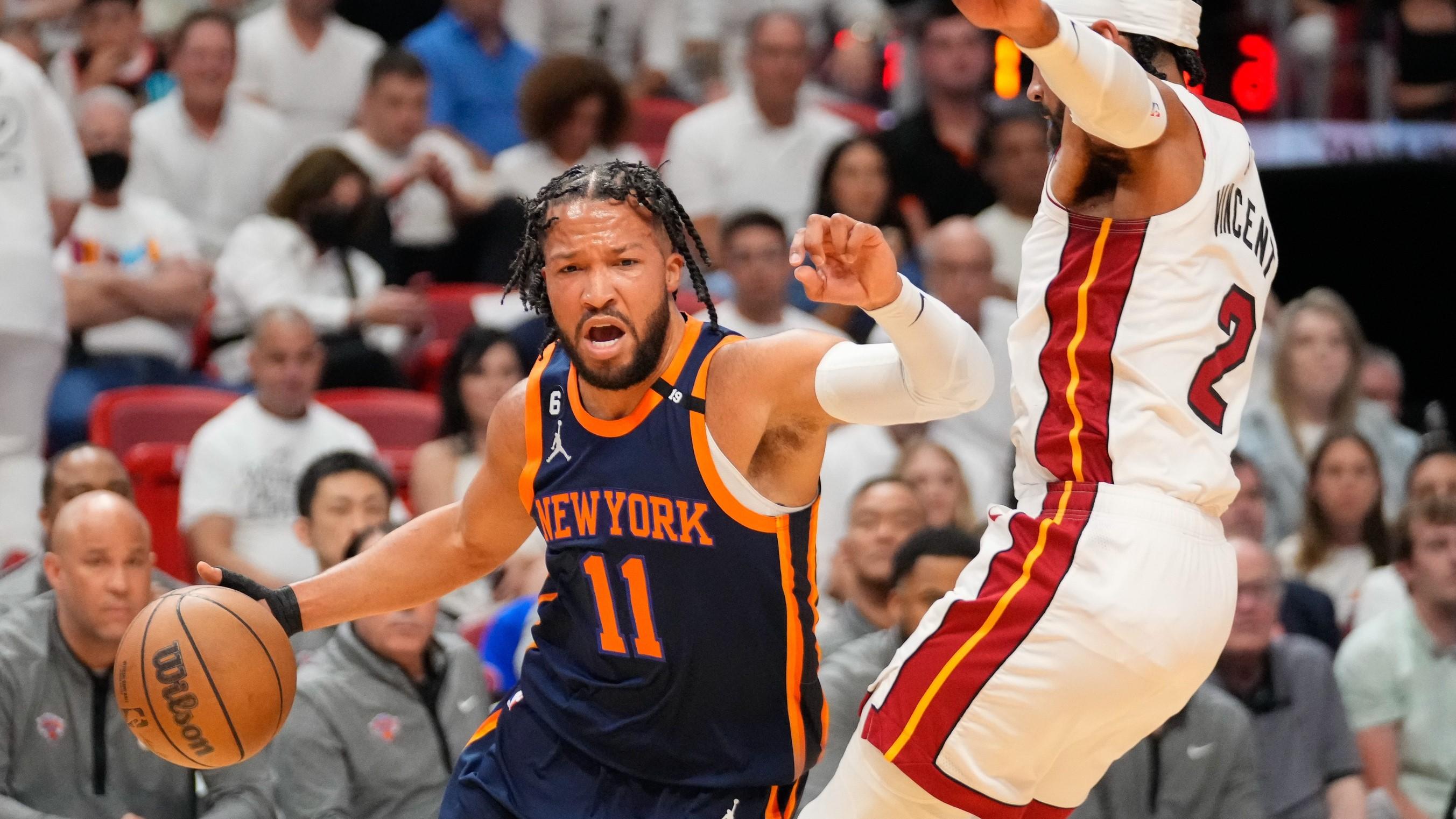 May 6, 2023; Miami, Florida, USA; New York Knicks guard Jalen Brunson (11) dribbles the ball past Miami Heat guard Gabe Vincent (2) during the first quarter of game three of the 2023 NBA playoffs at Kaseya Center. / Rich Storry-USA TODAY Sports