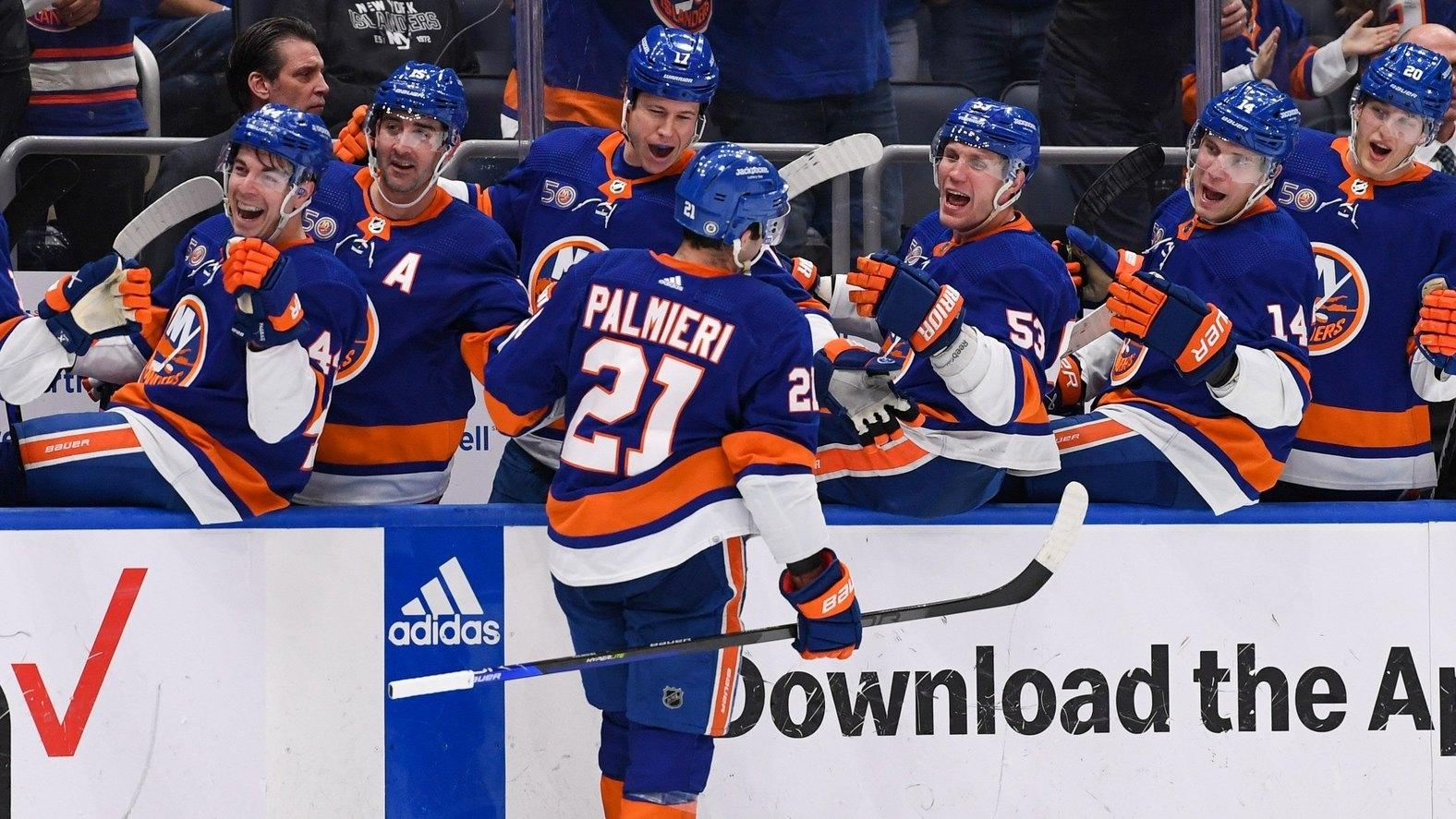 New York Islanders center Kyle Palmieri (21) celebrates his goal against the New Jersey Devils with the New York Islanders bench, / Dennis Schneidler-USA TODAY Sports