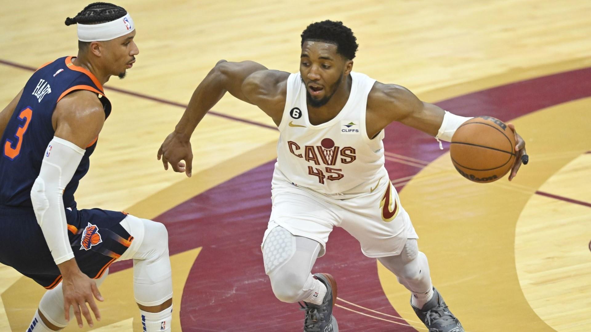 Apr 15, 2023; Cleveland, Ohio, USA; Cleveland Cavaliers guard Donovan Mitchell (45) dribbles beside New York Knicks guard Josh Hart (3) in the second quarter of game one of the 2023 NBA playoffs at Rocket Mortgage FieldHouse. / David Richard-USA TODAY Sports