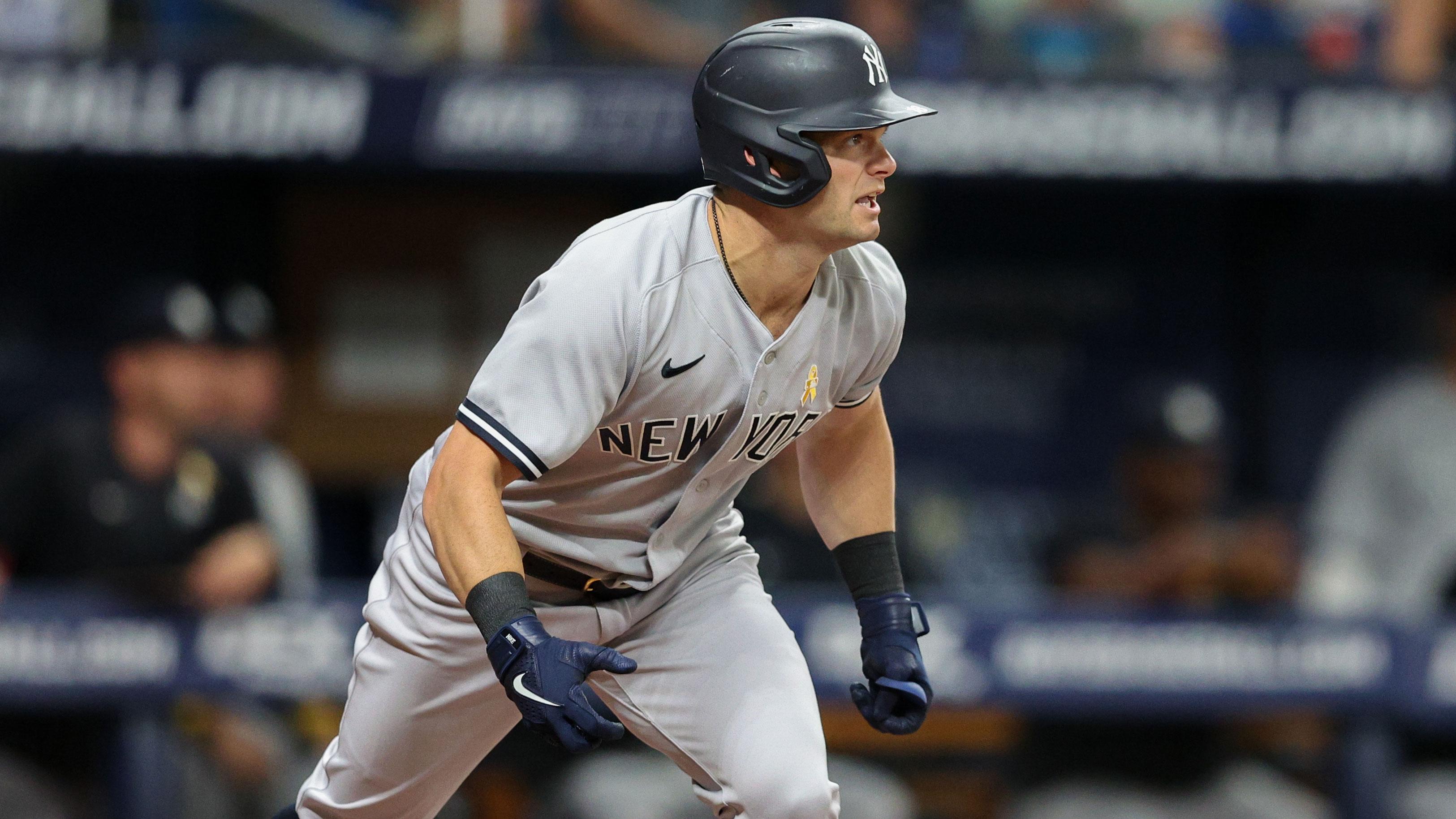 Sep 2, 2022; St. Petersburg, Florida, USA; New York Yankees left fielder Andrew Benintendi (18) doubles against the Tampa Bay Rays in the first inning at Tropicana Field. / Nathan Ray Seebeck-USA TODAY Sports