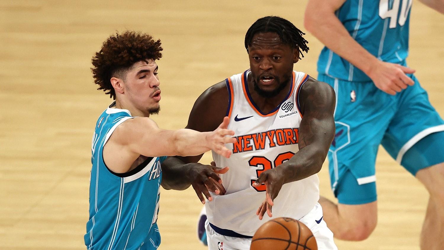 Julius Randle #30 of the New York Knicks passes under pressure from LaMelo Ball #2 of the Charlotte Hornets in the second quarter at Madison Square Garden. / Pool Photo-USA TODAY Sports