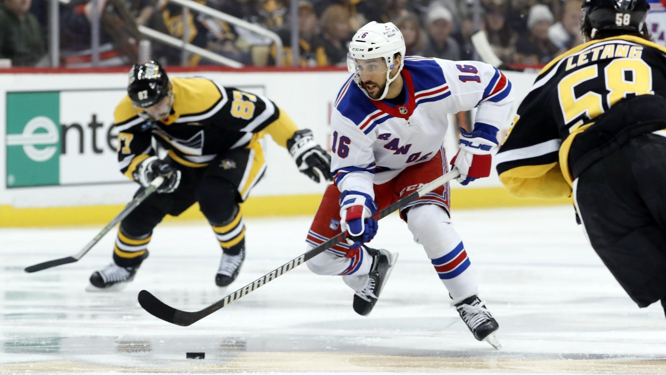 Dec 20, 2022; Pittsburgh, Pennsylvania, USA; New York Rangers center Vincent Trocheck (16) moves the puck against the Pittsburgh Penguins during the first period at PPG Paints Arena. / Charles LeClaire-USA TODAY Sports
