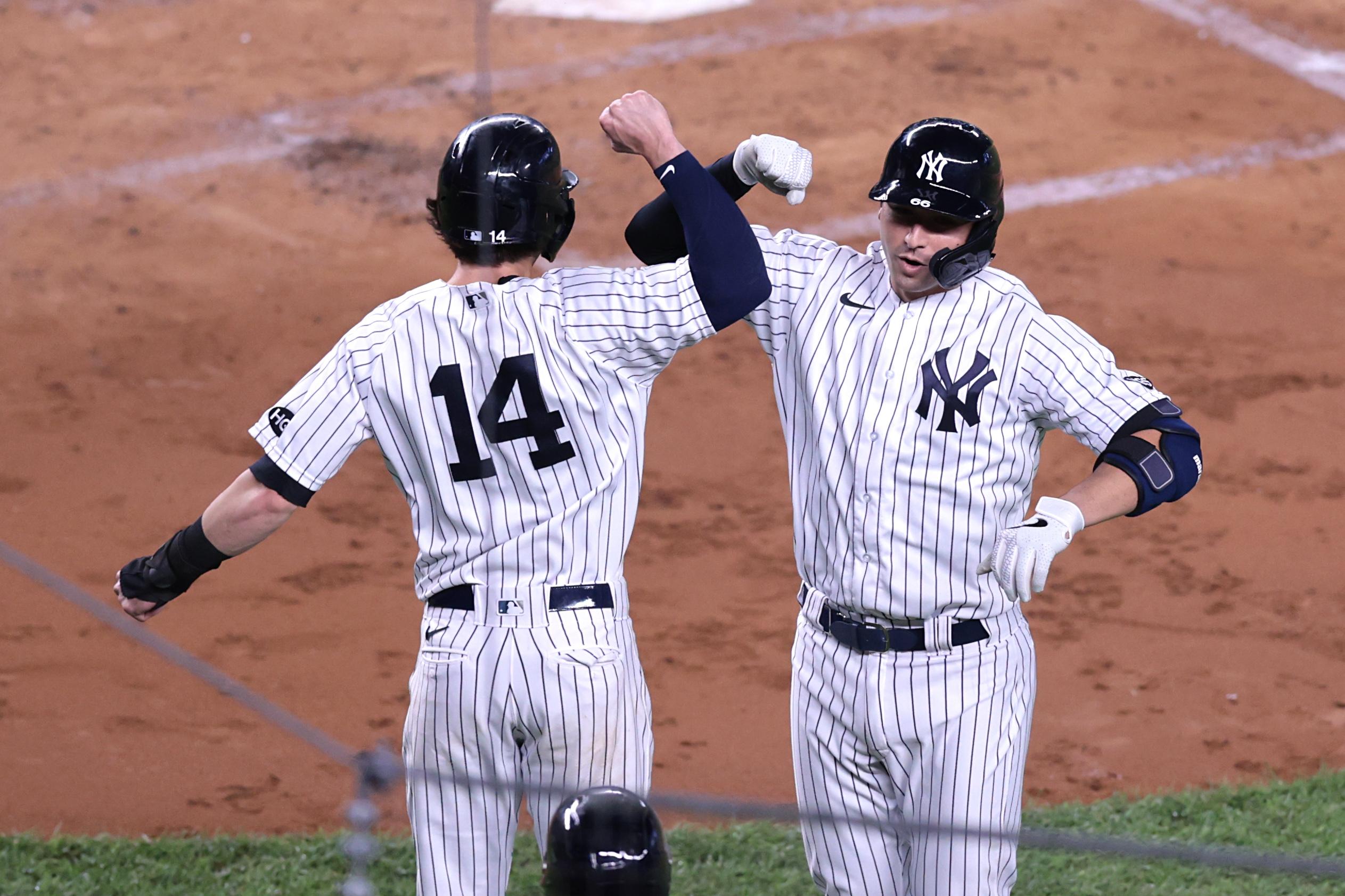 Sep 16, 2020; Bronx, New York, USA; New York Yankees catcher Kyle Higashioka (66) celebrates his two run home run with shortstop Tyler Wade (14) during the third inning against the Toronto Blue Jays at Yankee Stadium. / Vincent Carchietta-USA TODAY Sports