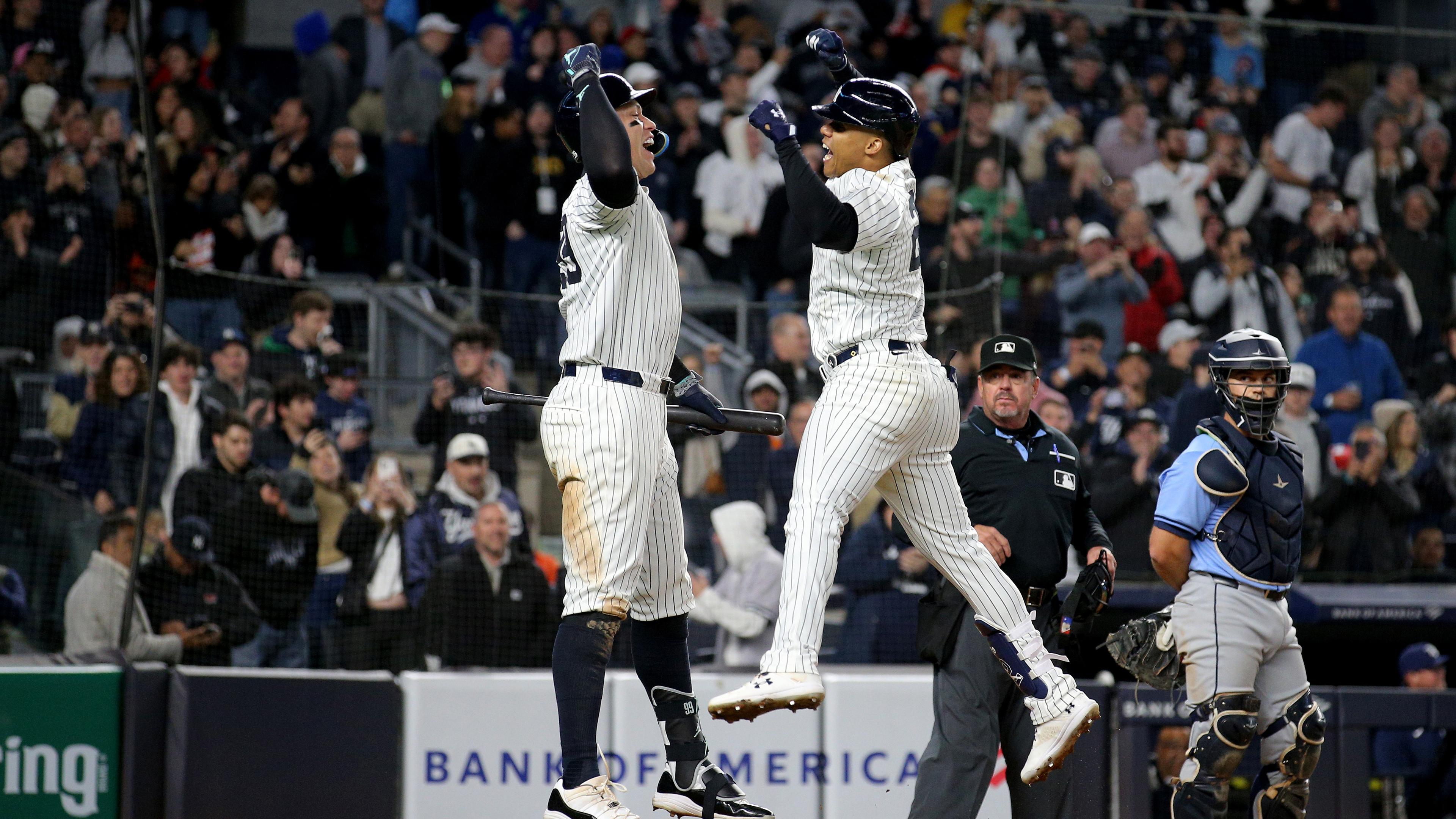 New York Yankees right fielder Juan Soto (22) celebrates with center fielder Aaron Judge (99) after hitting a three run home run against the Tampa Bay Rays during the seventh inning at Yankee Stadium. / Brad Penner-USA TODAY Sports