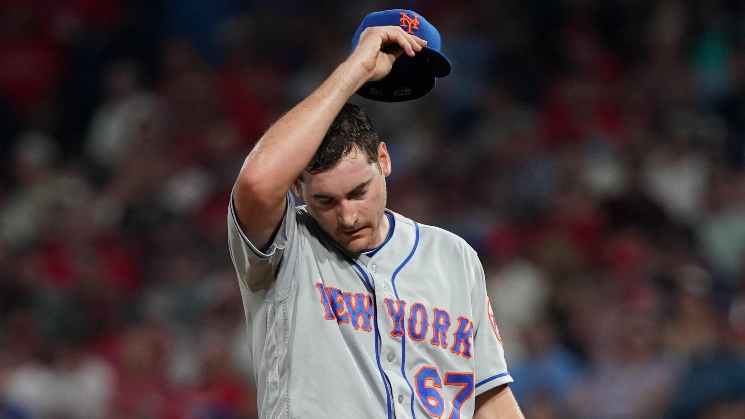 Jun 26, 2019; Philadelphia, PA, USA; New York Mets starting pitcher Seth Lugo (67) reacts after a Philadelphia Phillies score during the seventh inning at Citizens Bank Park. Mandatory Credit: Bill Streicher-USA TODAY Sports / Bill Streicher-USA TODAY Sports