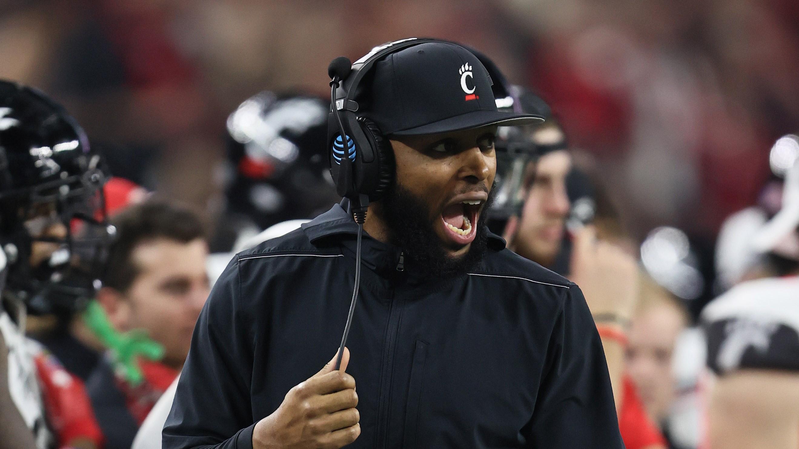 Dec 31, 2021; Arlington, Texas, USA; Cincinnati Bearcats defensive line coach Greg Scruggs yells from the sidelines in the third quarter against the the Alabama Crimson Tide during the 2021 Cotton Bowl college football CFP national semifinal game at AT&T Stadium. Mandatory Credit: Matthew Emmons-USA TODAY Sports / Matthew Emmons-USA TODAY Sports
