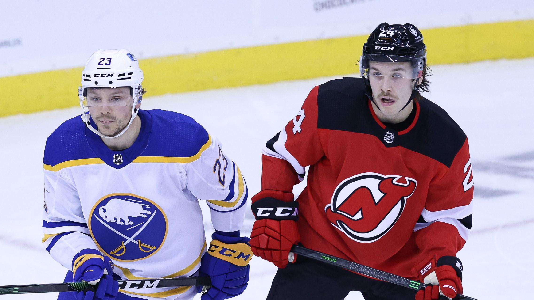 Buffalo Sabres center Sam Reinhart (23) battles for positions against New Jersey Devils defenseman Ty Smith (24) during the second period at Prudential Center. / Vincent Carchietta